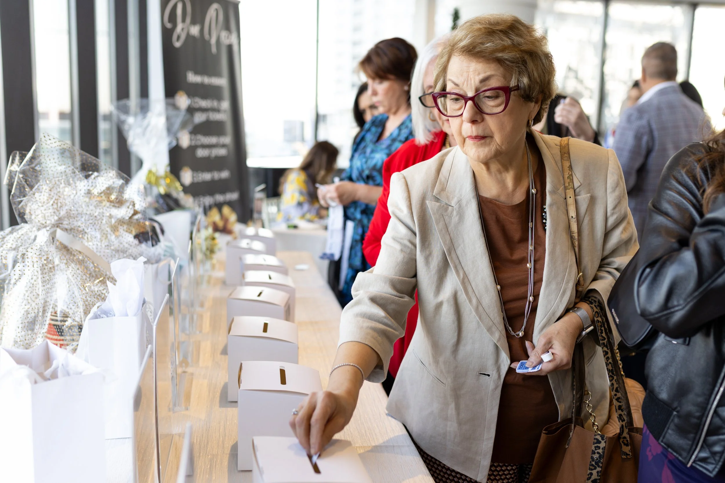 Guests submitting ballots for raffle items