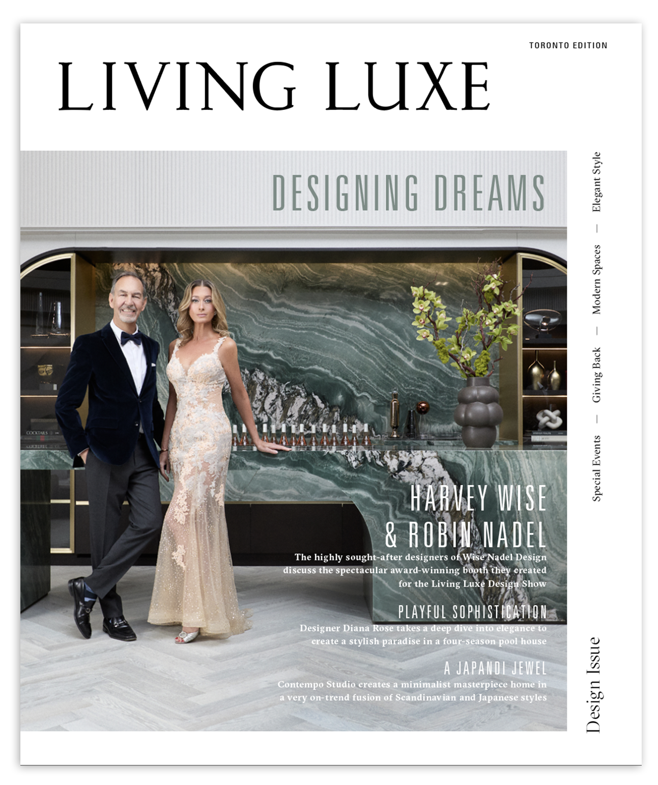 Magazine cover of Living Luxe featuring a man in a tuxedo and a woman in a lace gown standing in front of a modern marble bar with a large green marble wall and a grey vase with green plants.