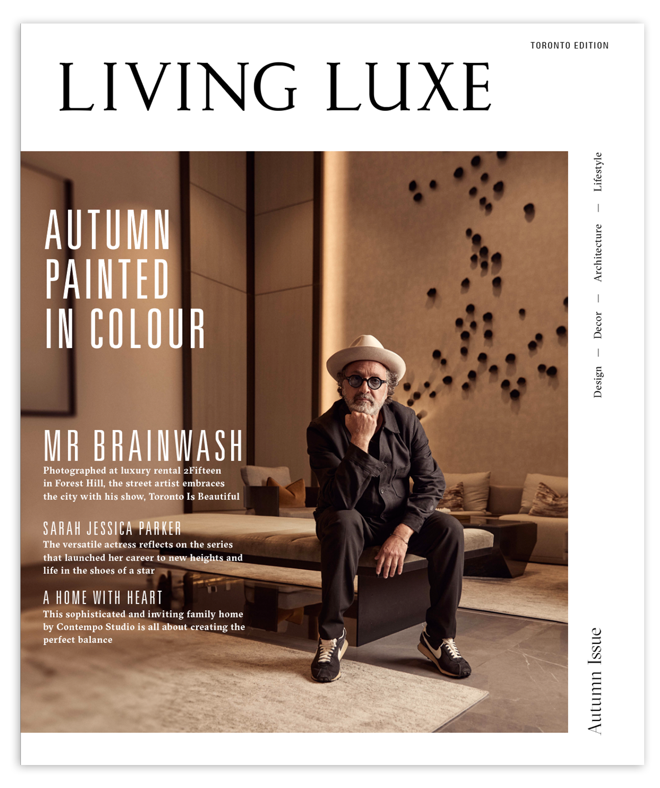 Cover of Living Luxe magazine featuring Mr. Brainwash sitting in a modern, stylish living room with beige walls and artistic decor, wearing a hat, glasses, black shirt, and sneakers.