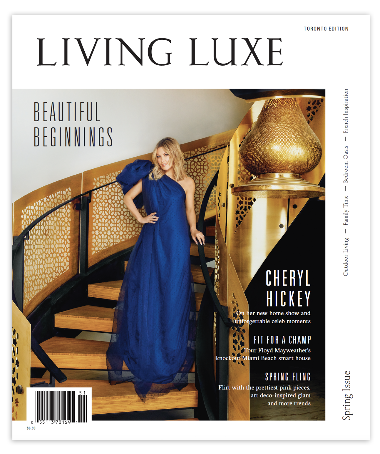Cover of Living Luxe magazine featuring a woman in a pink dress and a man in a dark coat, standing in an elegant interior space with pink flowers on a table.