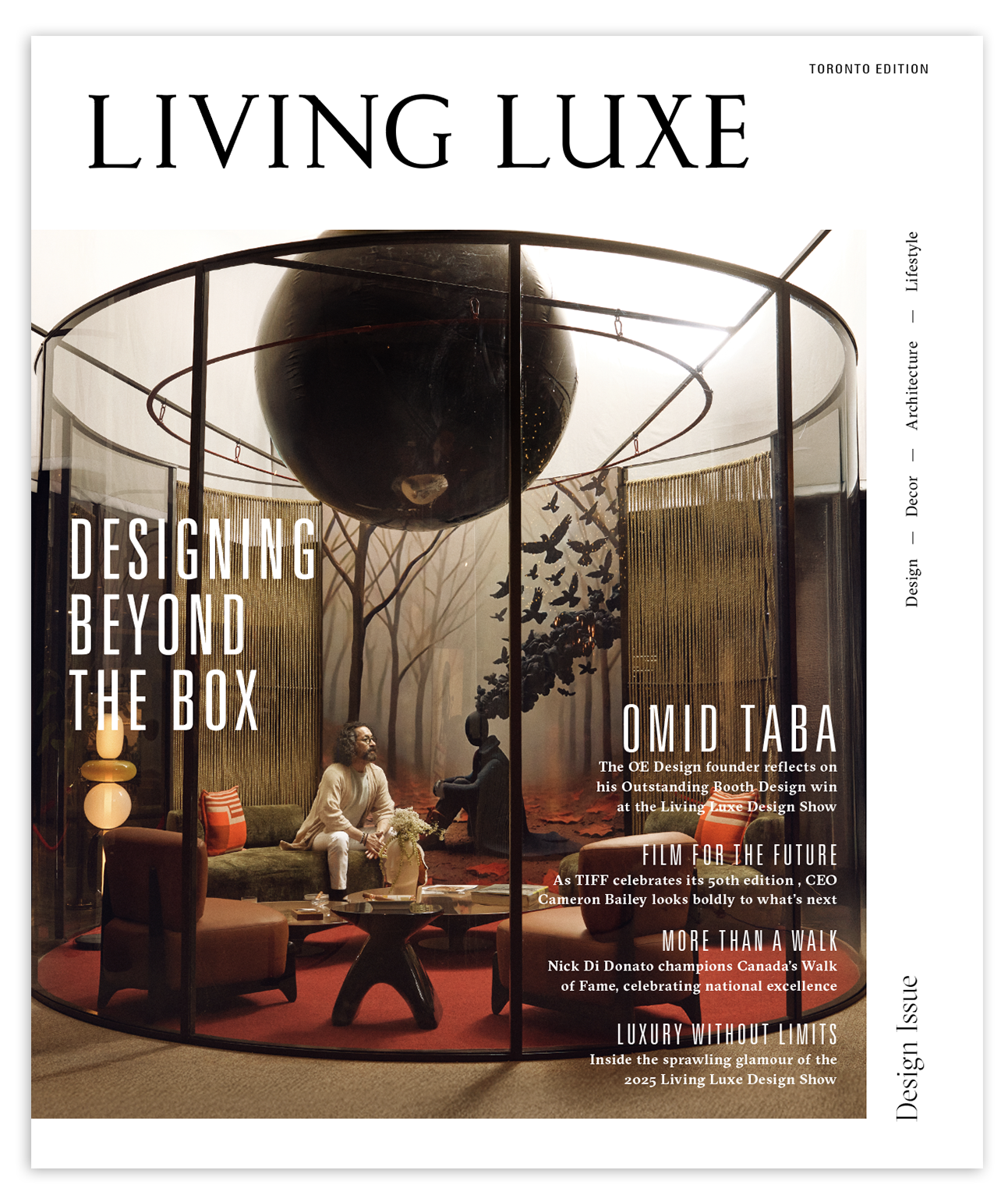 Cover of Living Luxe magazine featuring an interior design scene with a glass-enclosed room, a large black globe-like sculpture hanging from the ceiling, a person sitting on a sofa, and decorative elements.