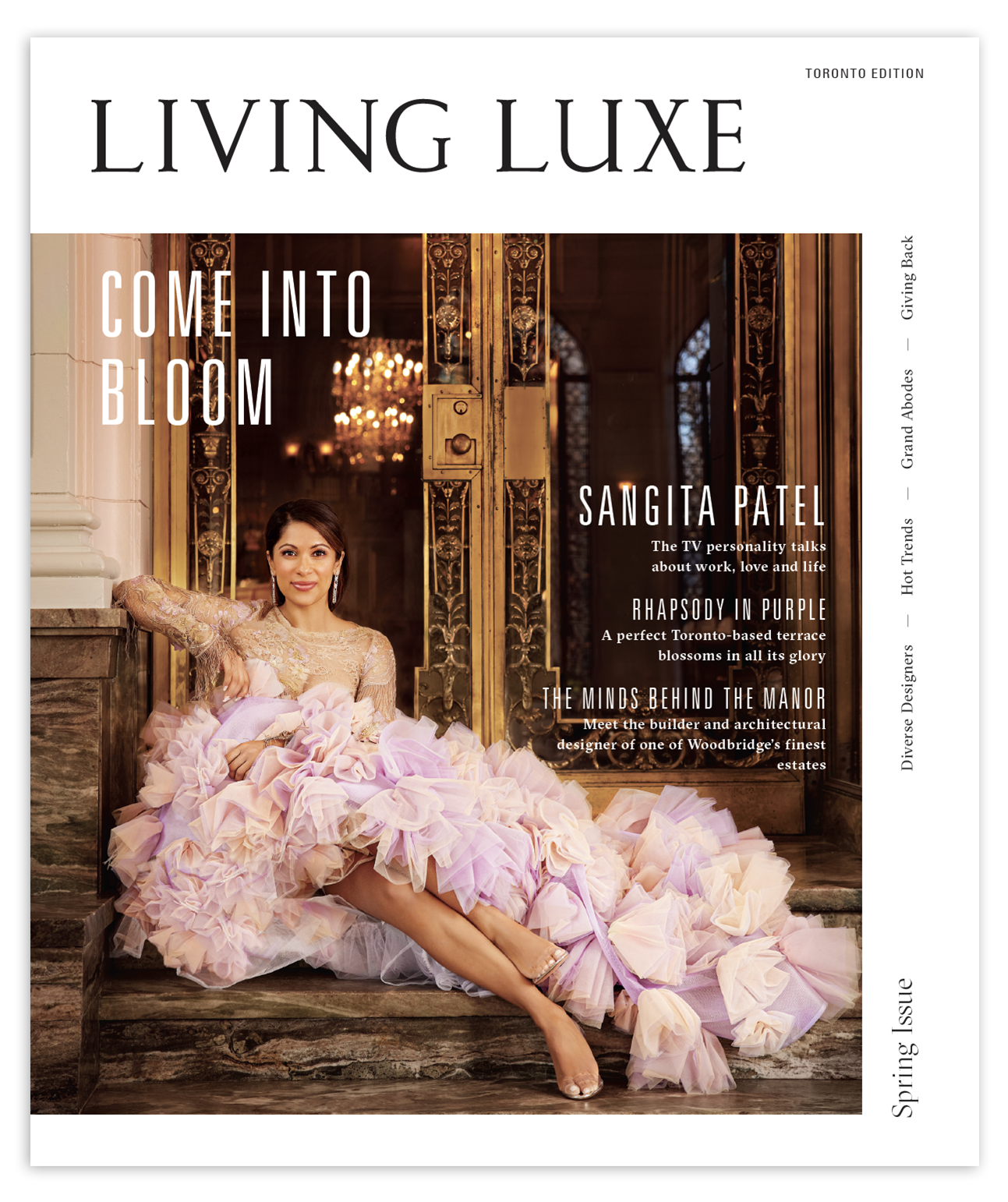 Cover of Living Luxe magazine featuring a woman in a pink dress and a man in a dark coat, standing in an elegant interior space with pink flowers on a table.