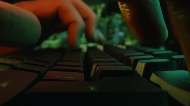 Close-up of hands typing on a keyboard, representing human-AI collaboration, conversation, idea development, and the article GPT Is Not Intelligence. It’s a Conversation Partner by AI Creator 21000.