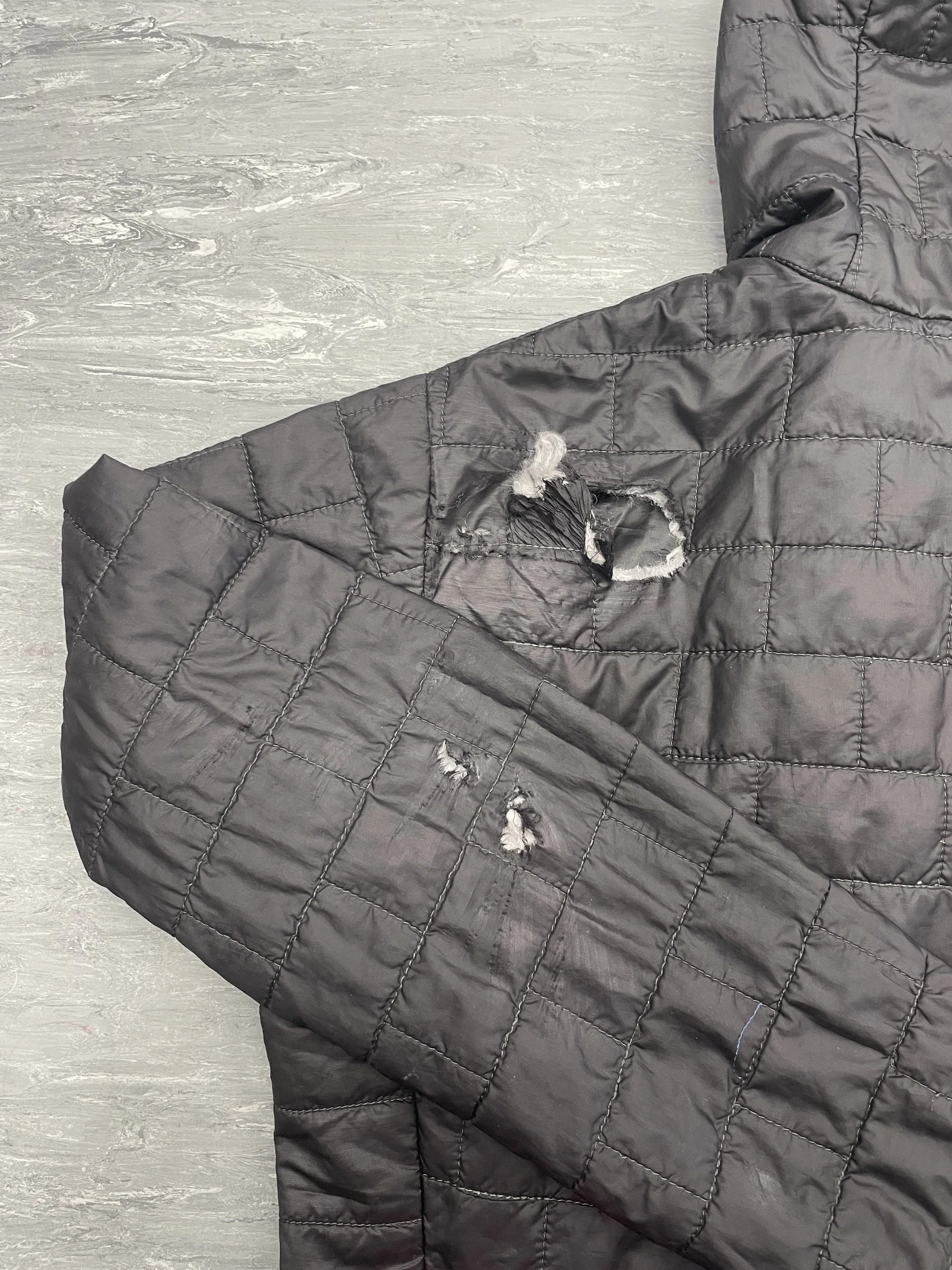 Burn holes on coat (going through down)