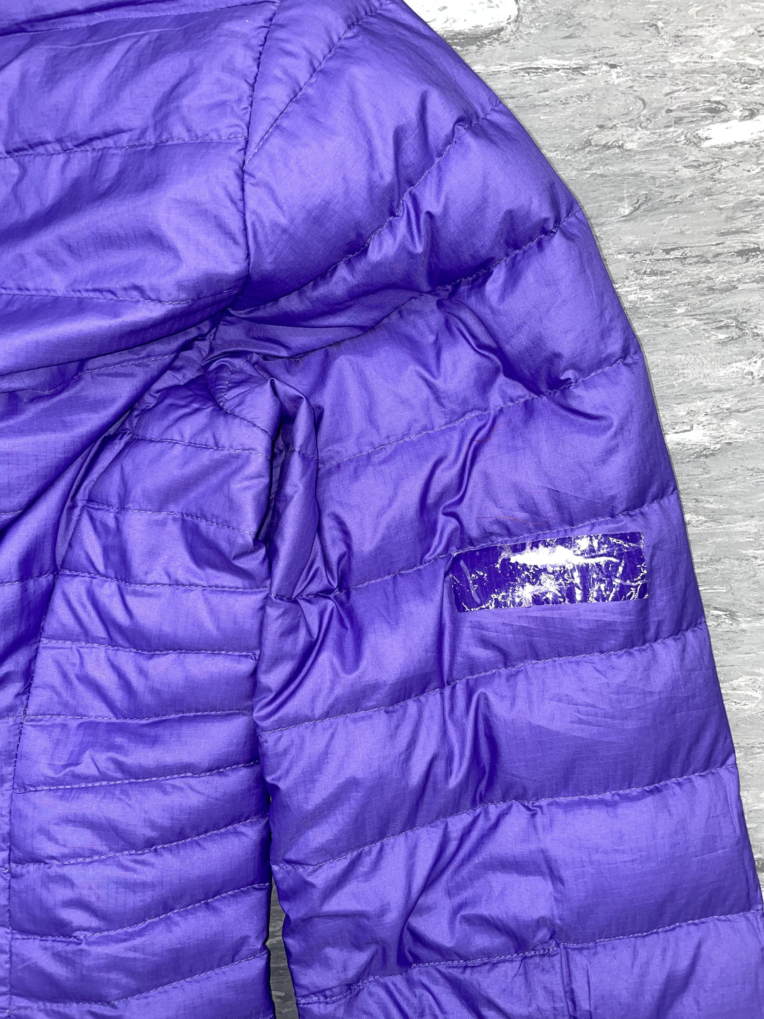 Tear to coat sleeve covered with temporary tape repair 