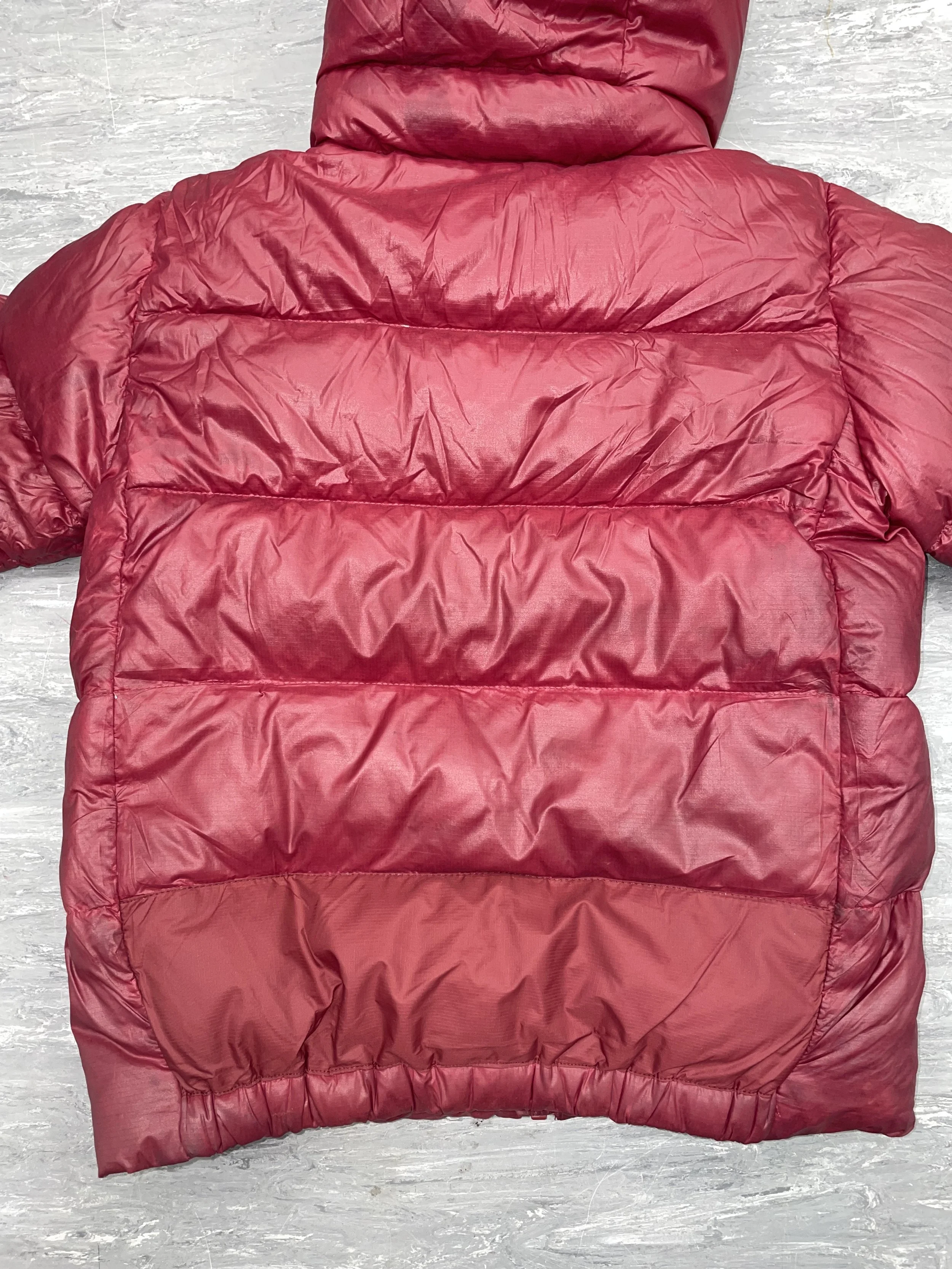 Colour-matched panel repair with down refilled to restore insulation 