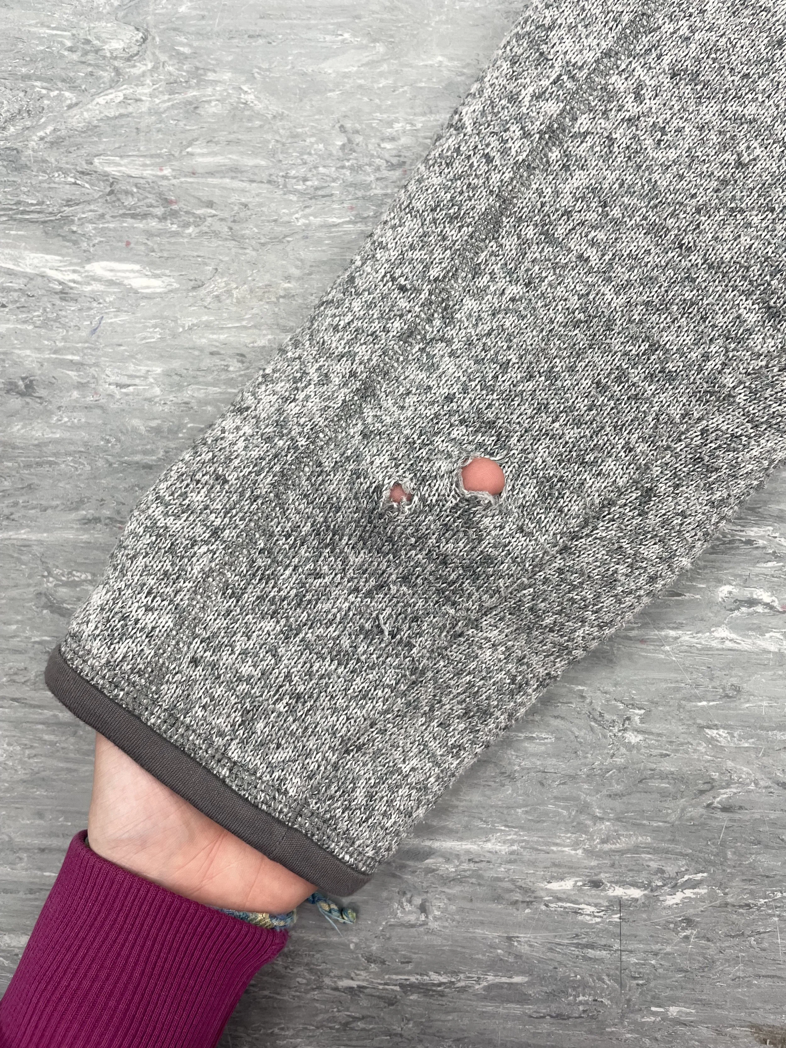 Small holes on jersey sleeve