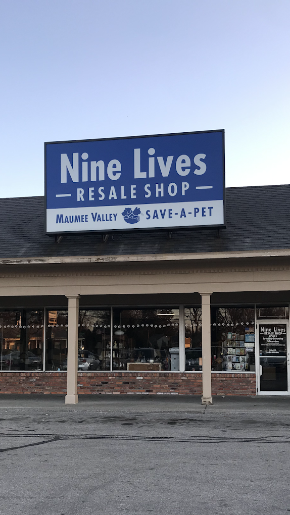 Sign for Nine Lives Resale Shop in Maumee Valley, selling pet supplies and promoting save-a-pet.