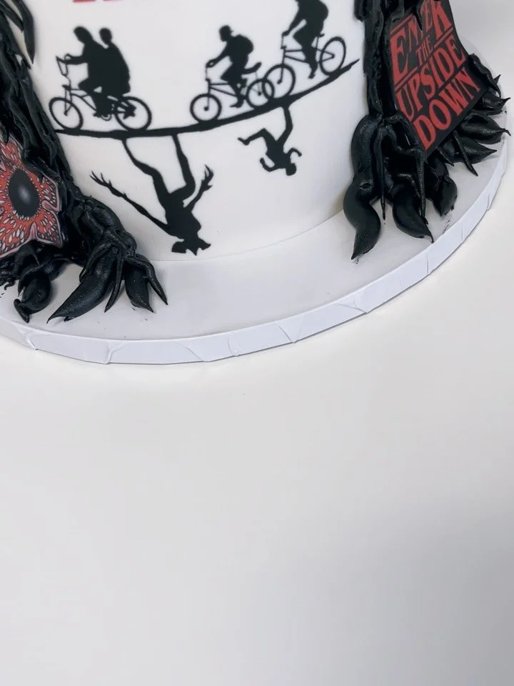 Stepping into the Upside Down 🕷️⚡ This Stranger Things&ndash;inspired cake is packed with iconic details&mdash;from the Hellfire Club to eerie silhouettes and dark textures that bring Hawkins to life. A perfect centerpiece for any fan ready to celeb