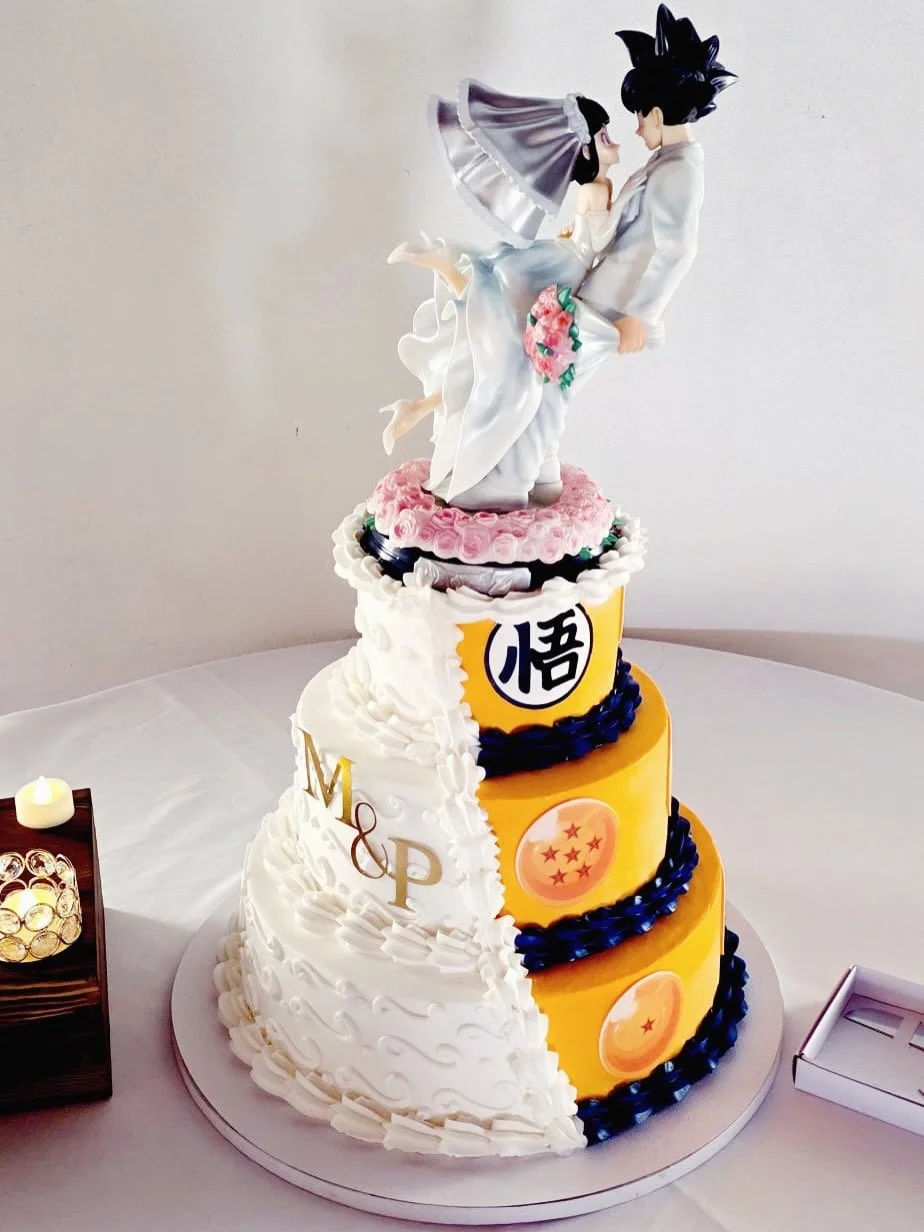 Two worlds, one love story 💍✨ From elegant wedding details to a fun Dragon Ball twist, this cake was made to celebrate Maria &amp; Patrick and their one-of-a-kind journey together. Thank you for letting us be a part of your special day! 💙🧡 
#Weddi