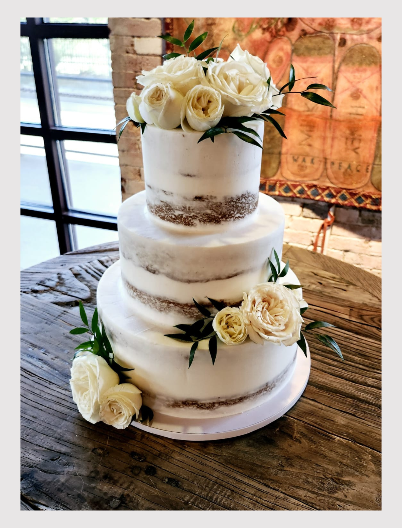 Semi naked wedding cake in St. Rogers Depot in El Paso, TX
