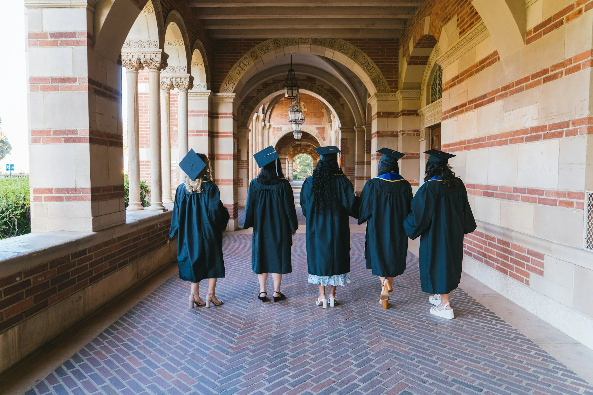 Group of people in caps and gowns graduating
