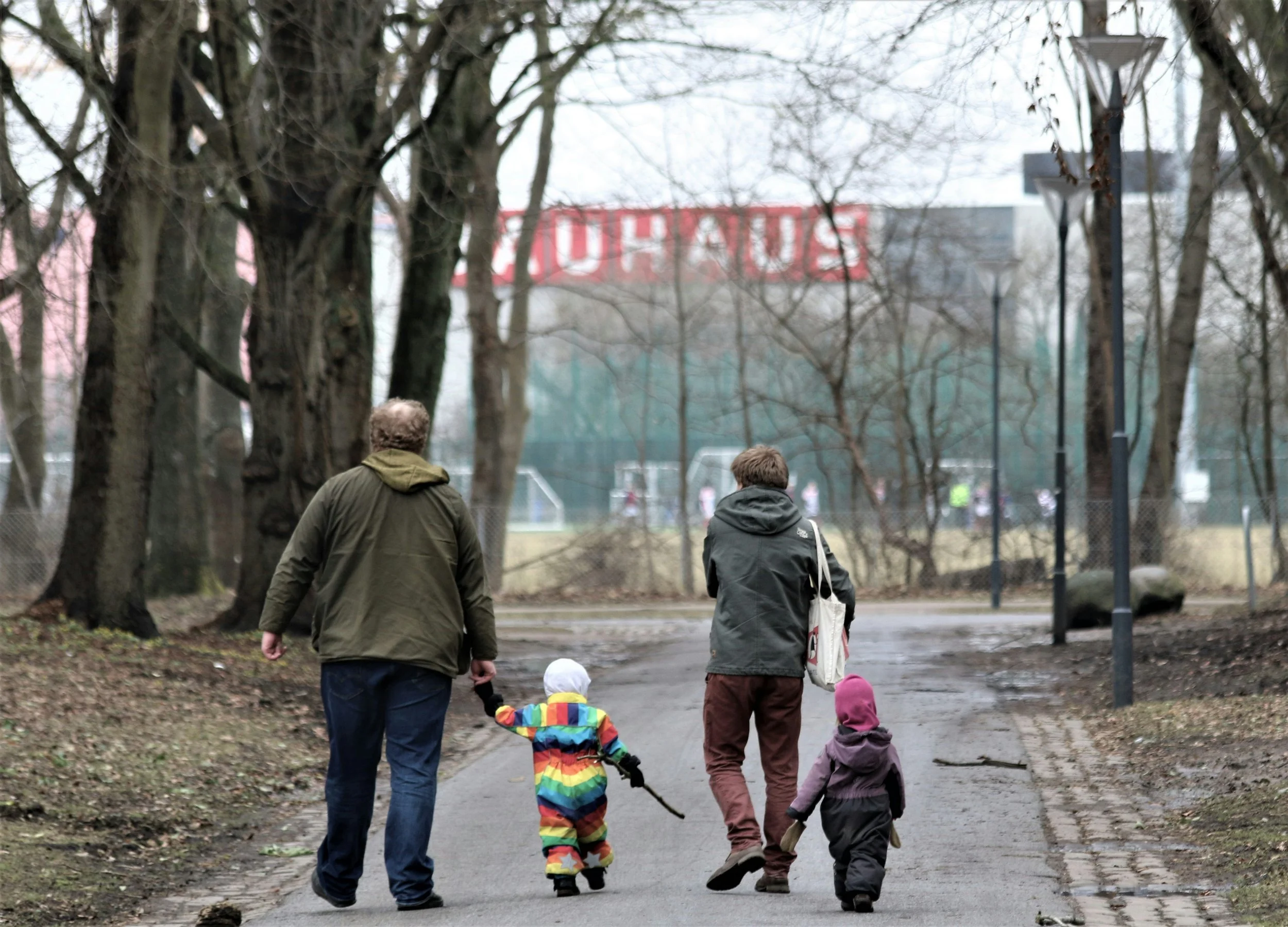 Ukrainian family walking with their backs turned to the camera