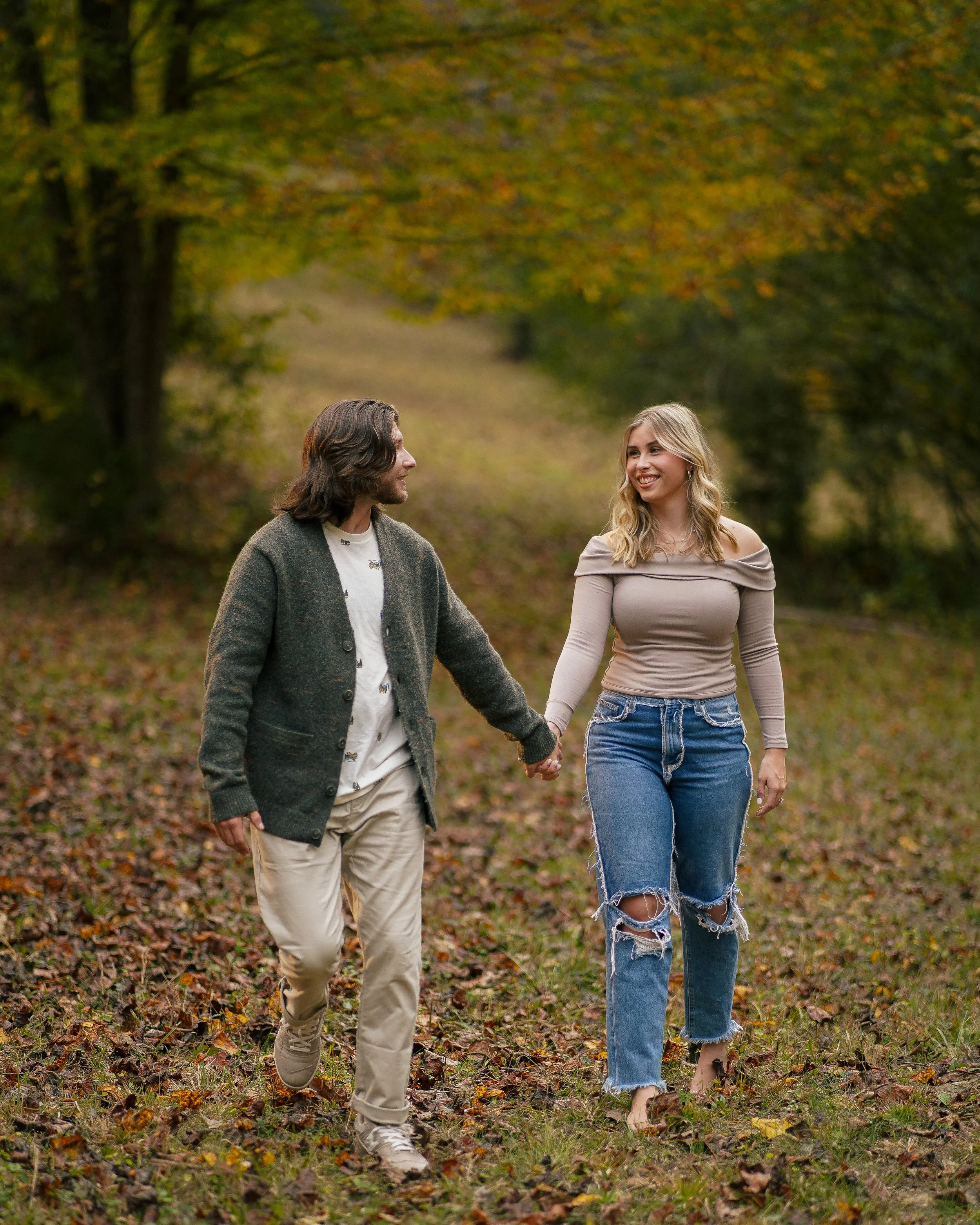 Fun and playful engagement session in a field in North Alabama