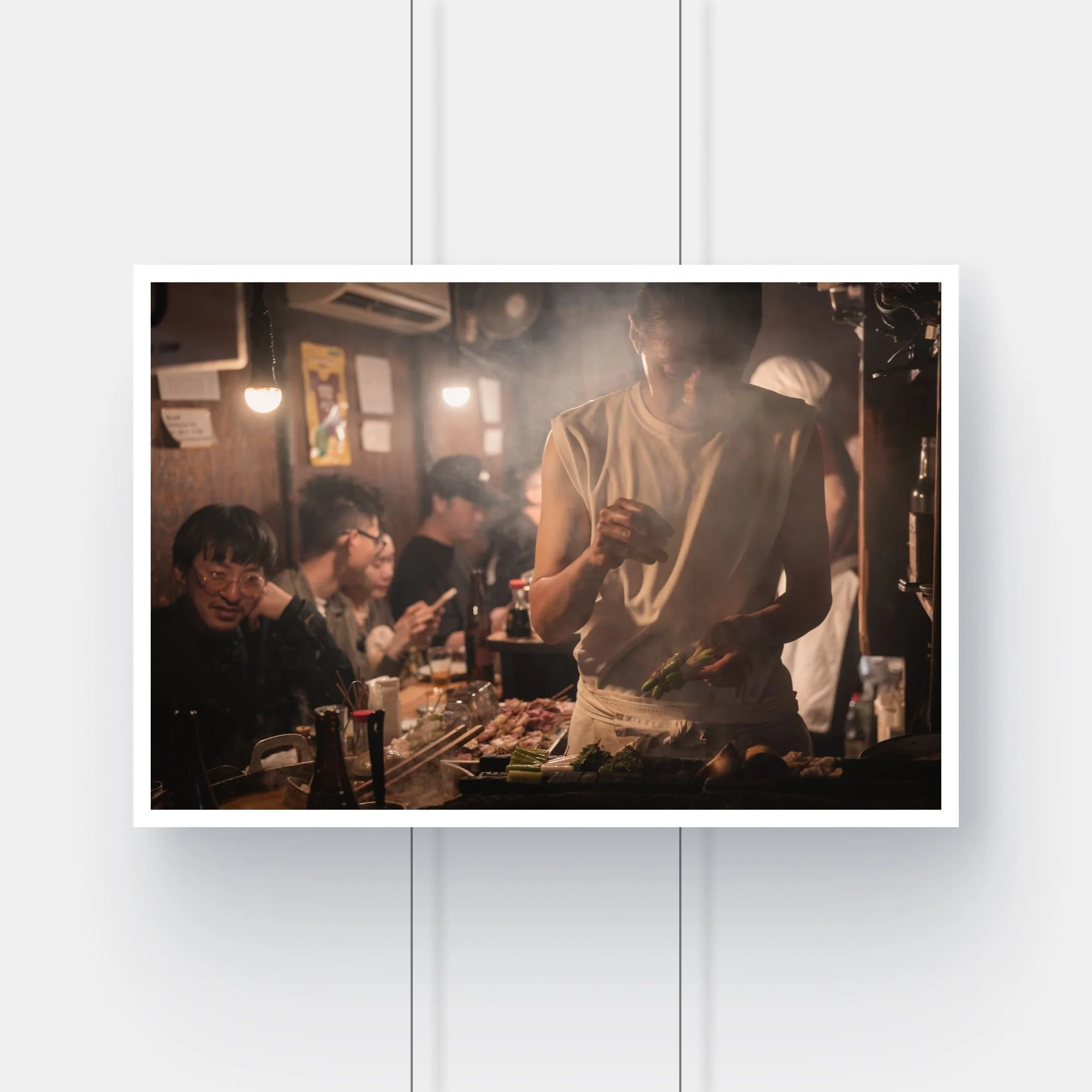 Limited edition street photography print of an izakaya cook in the Omoide Yokocho alley, Tokyo.