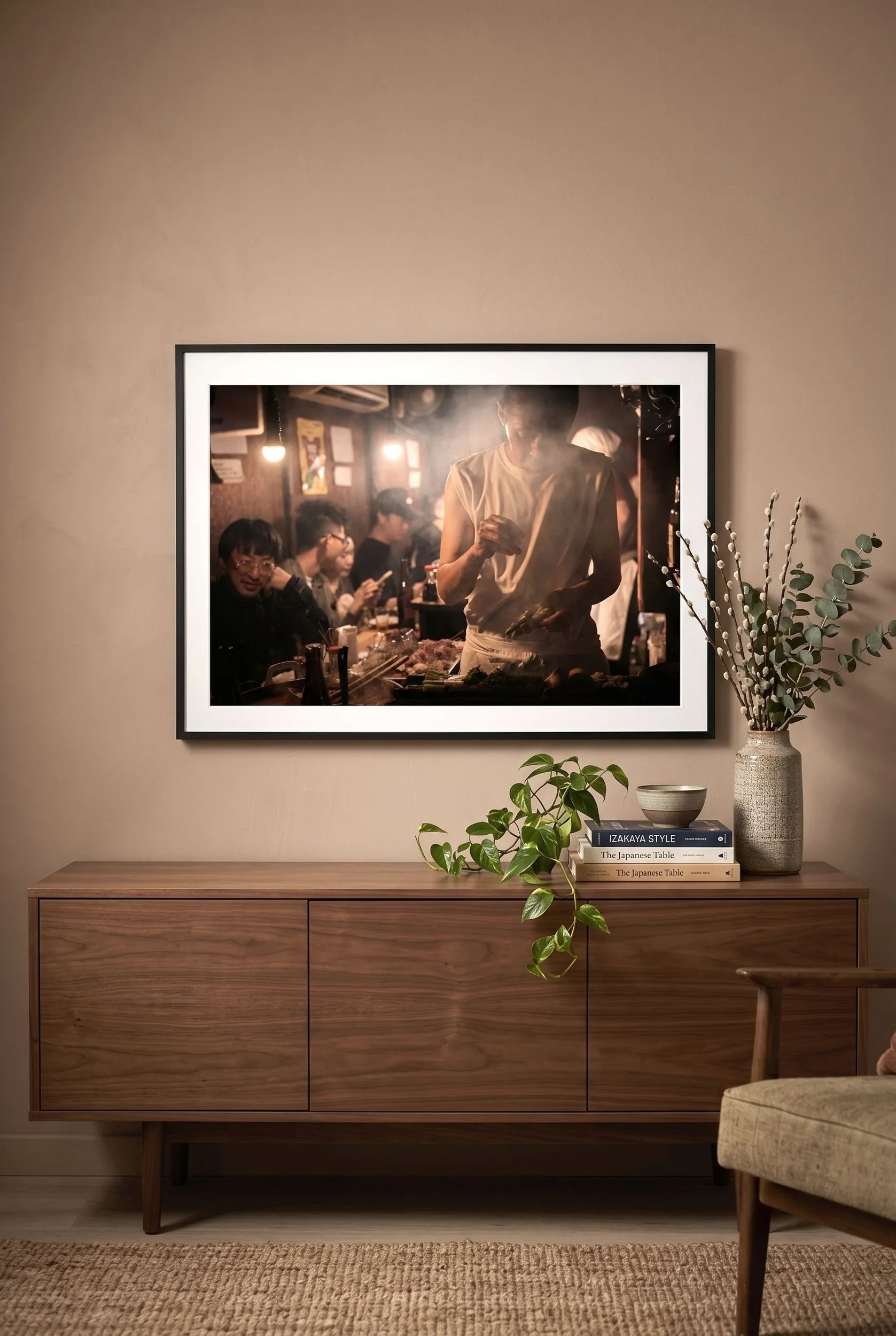 Izakaya print leaning against a wall in a lamp-lit interior.