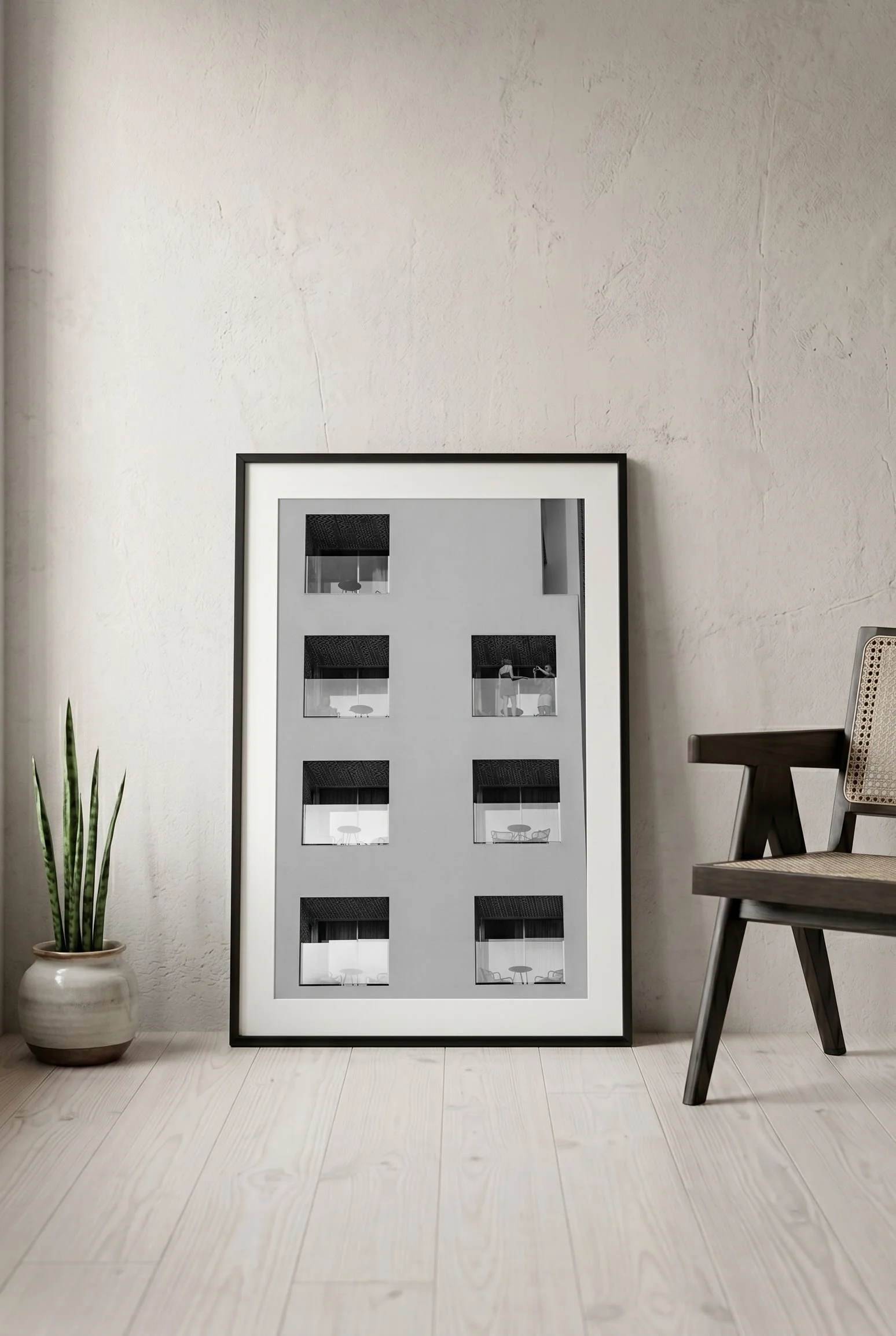 Málaga hotel windows print leaning on the floor against a neutral wall.