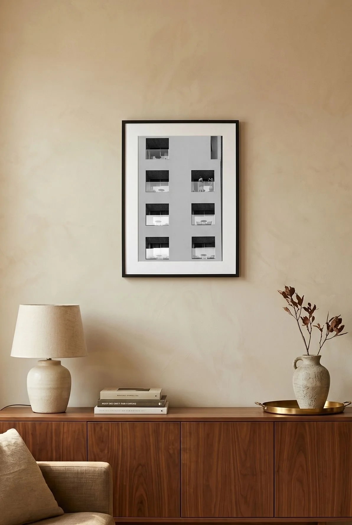 Málaga hotel print in a calm, neutral-toned interior.