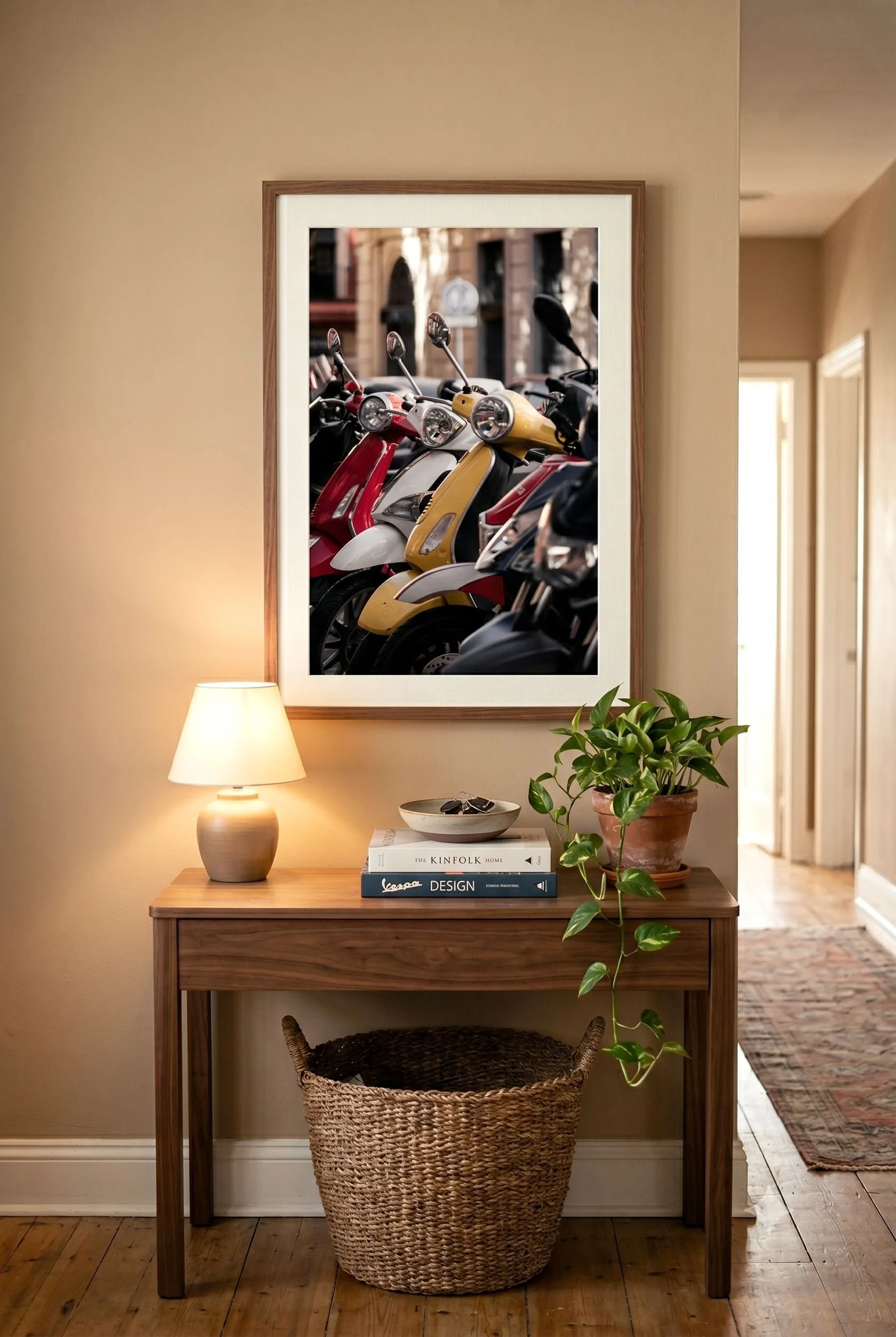 Row of colourful Vespas print in a walnut frame in a warm Seville interior.