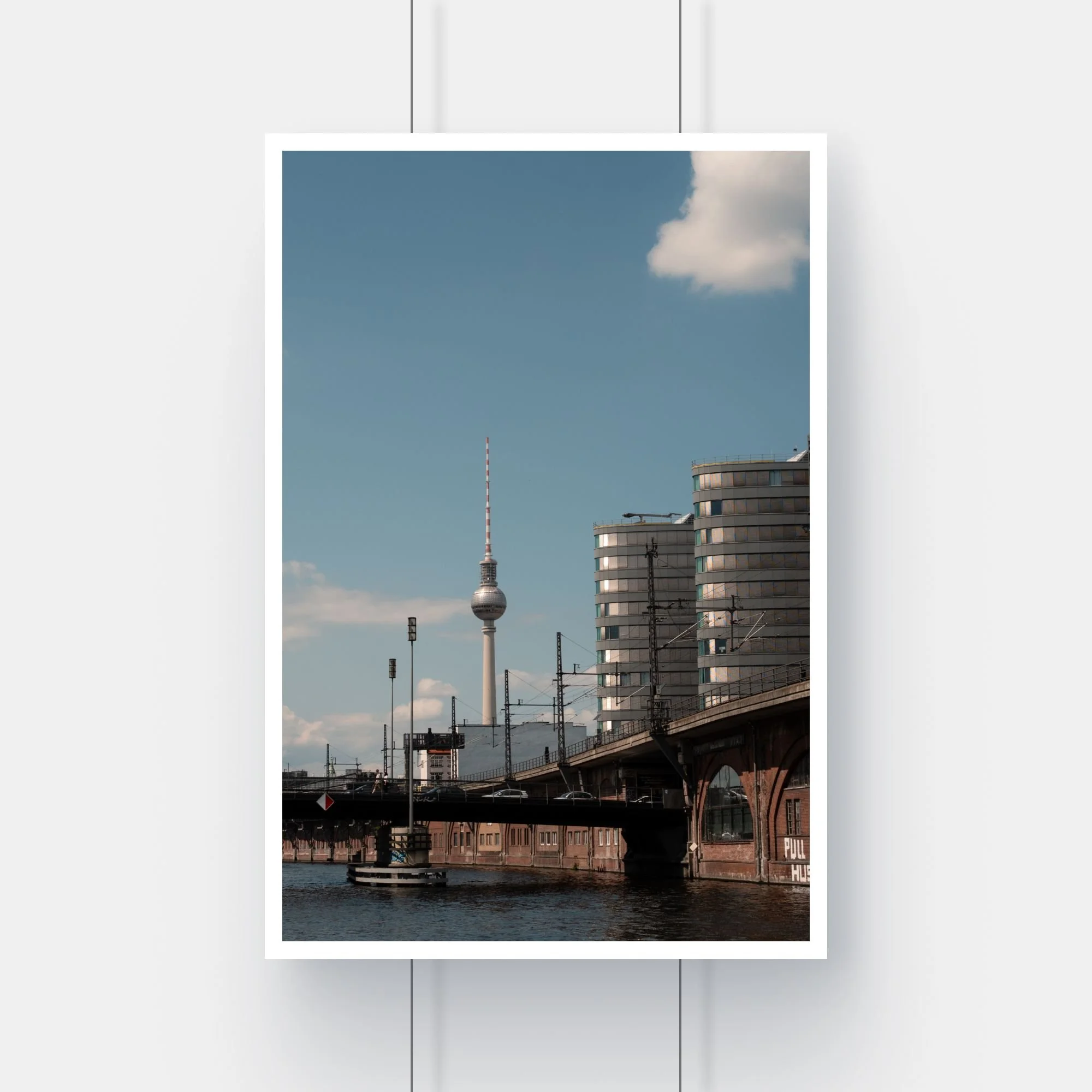 Limited edition fine art print of the Berlin Fernsehturm TV tower framed by city buildings.