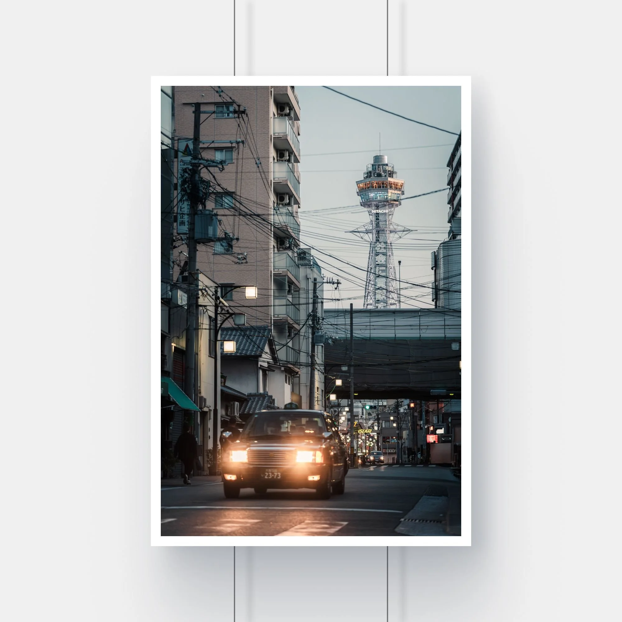 Limited edition fine art print of a Japanese taxi passing the Tsutenkaku Tower in Osaka.