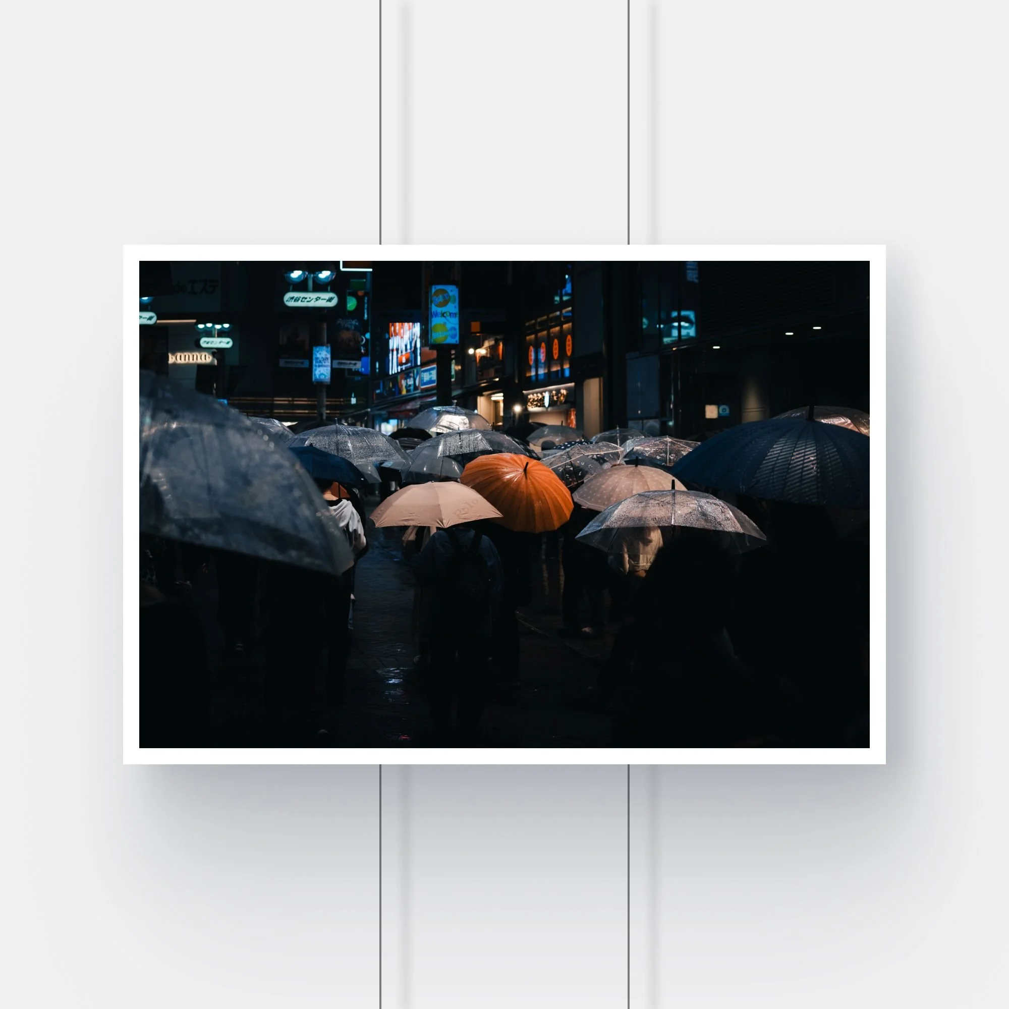 Limited edition street photography print of a person with an orange umbrella in the rain in Shibuya, Tokyo.