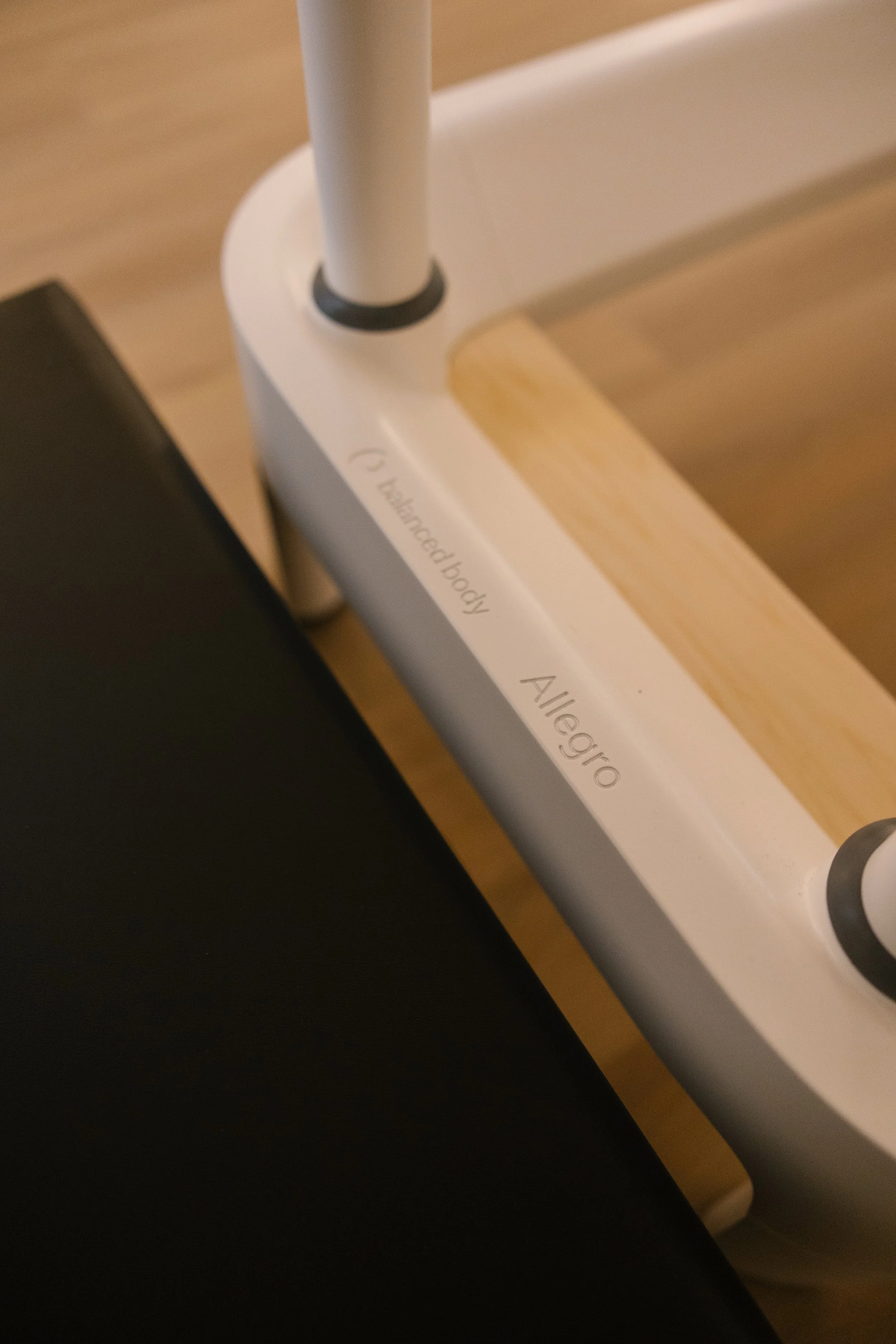 Close-up of a piece of furniture with the word "Alégro" and a label "Labeled body" on its edge.