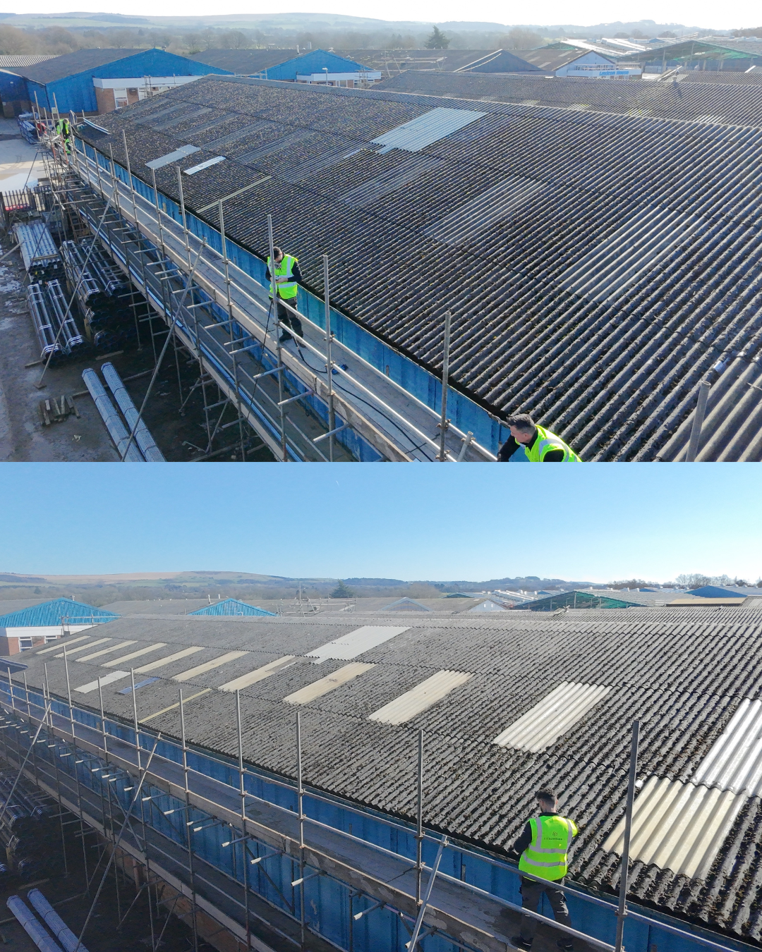 Roof repair workers standing on scaffolding inspecting and replacing damaged roof tiles on a large industrial building under a clear sky.
