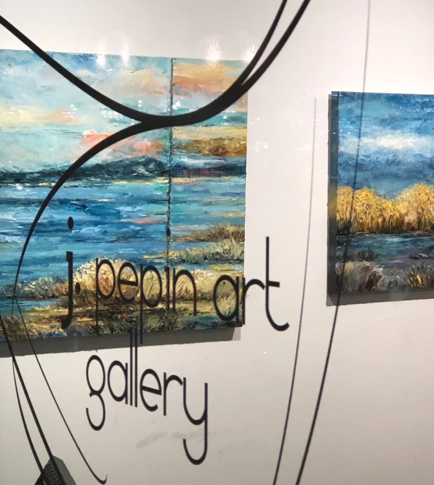 Two abstract landscapes viewed through window at J. Pepin Gallery, Portland