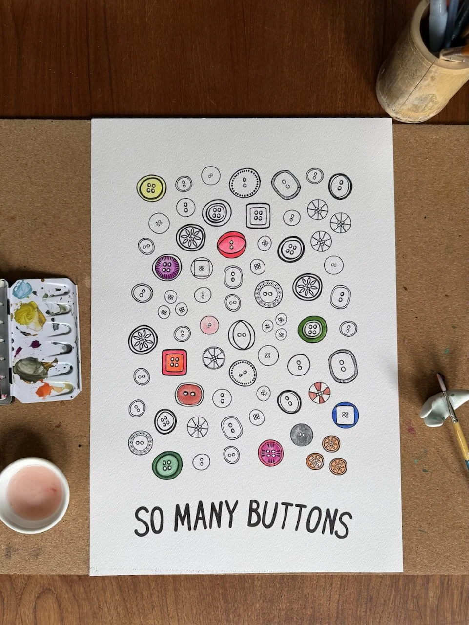 poster on table with watercolor paints