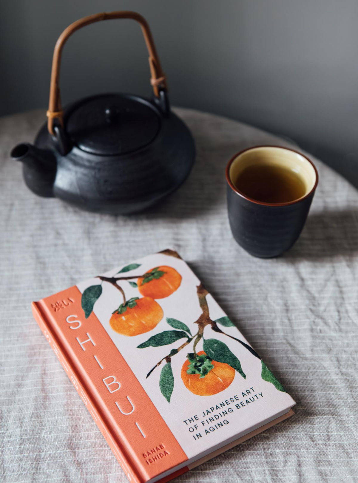 book with teapot and cup