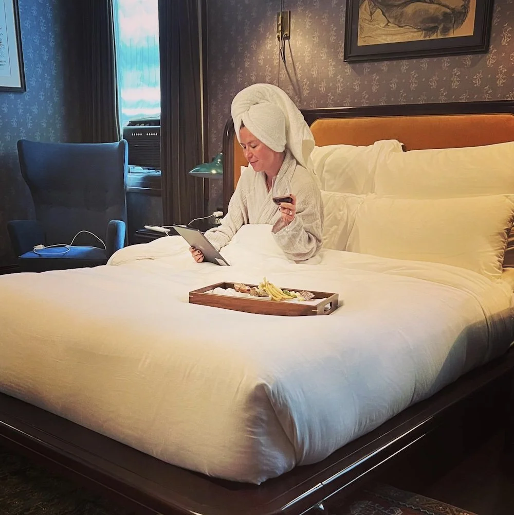 Erin in hotel room enjoying time away. Erin Crawford Styles