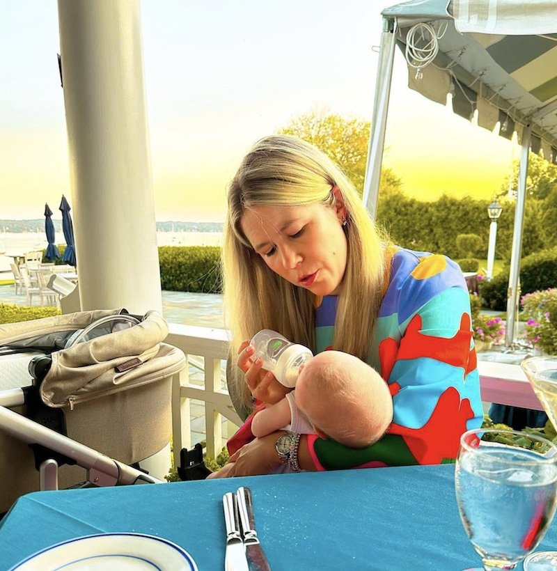 erin feeding her son with a backdrop of the sunshine and waterview.  erin crawfor styles