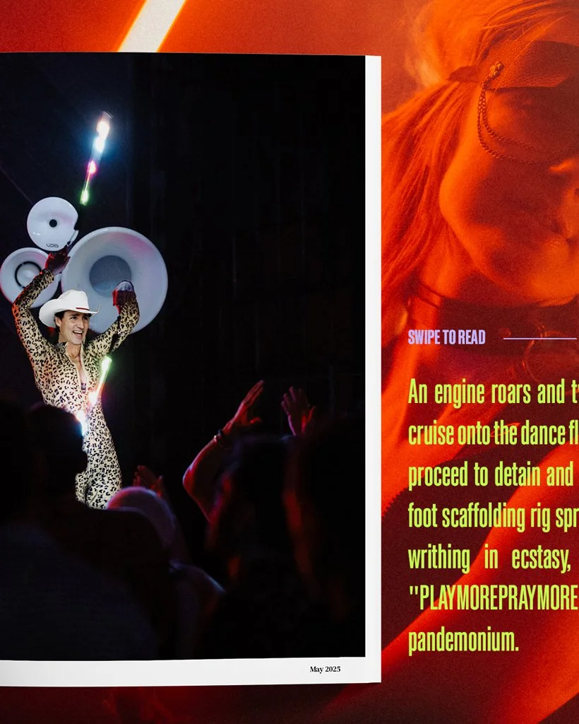 A woman in a leopard print outfit and white hat dancing on stage with large speakers in the background, audience members raising their hands, in a dark concert setting.