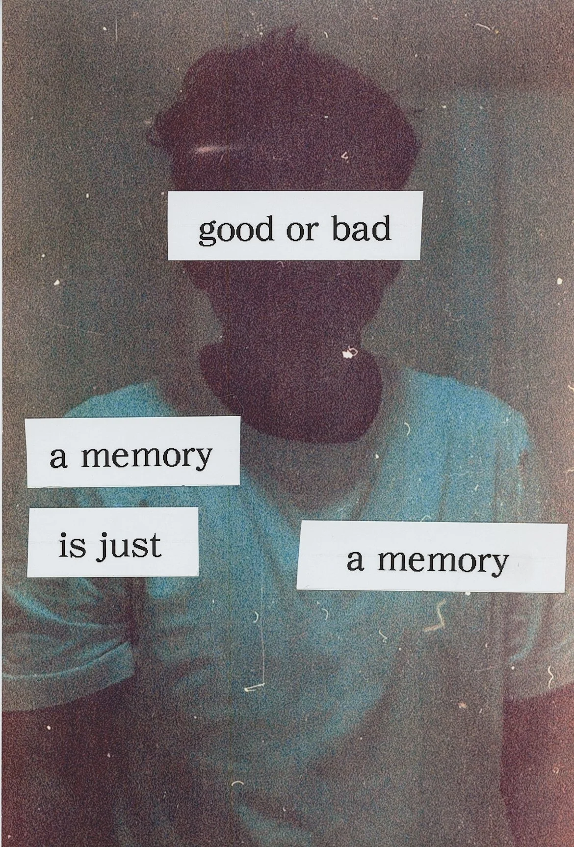 A person wearing a teal shirt, with a dark background, is seen with three white pieces of paper with black text reading 'good or bad', 'a memory', and 'is just'.