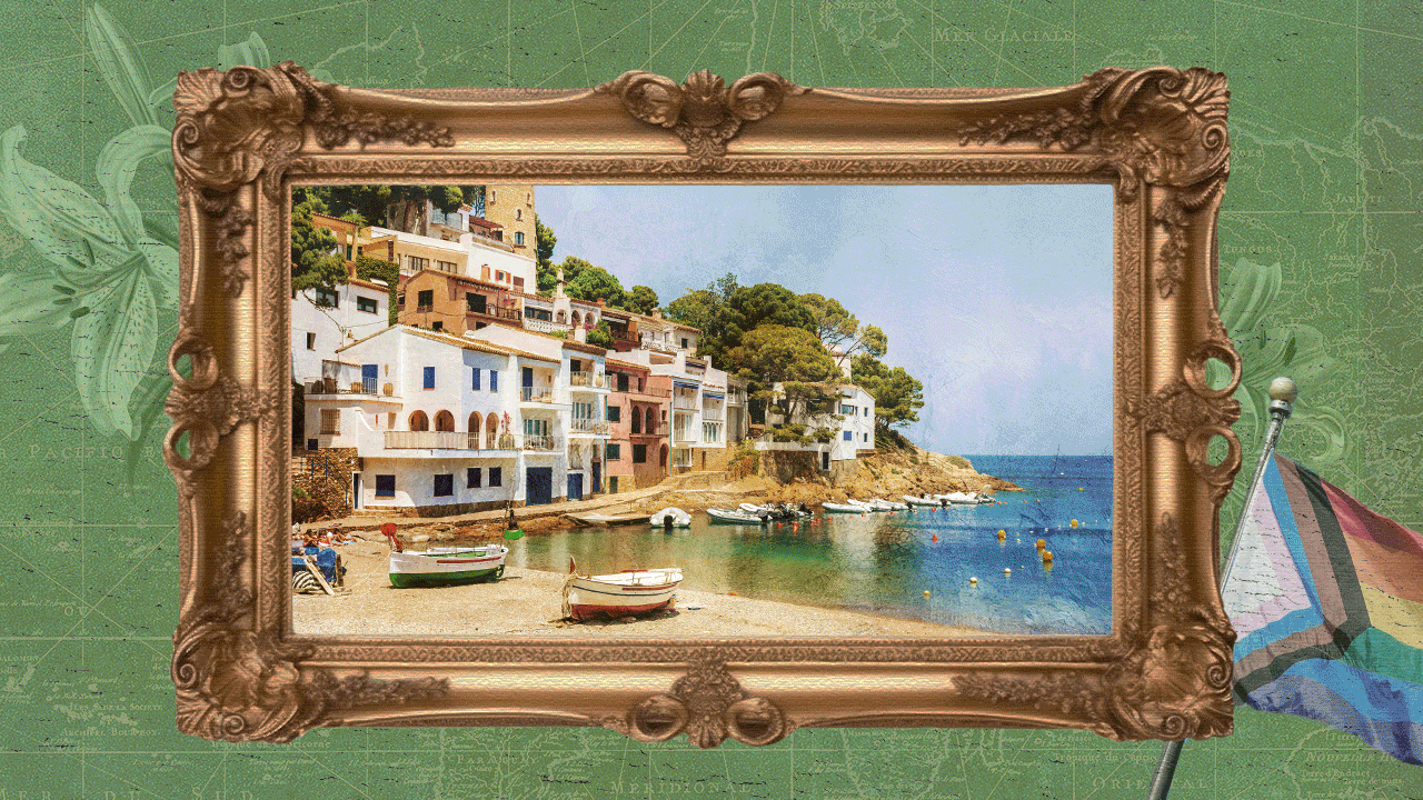 Colorful houses on a hillside beside the sea, with boats on a sandy beach and a partly cloudy sky.