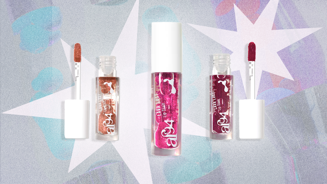 Three lip gloss bottles with their applicators outside, placed on a colorful graffiti-style background with stars.