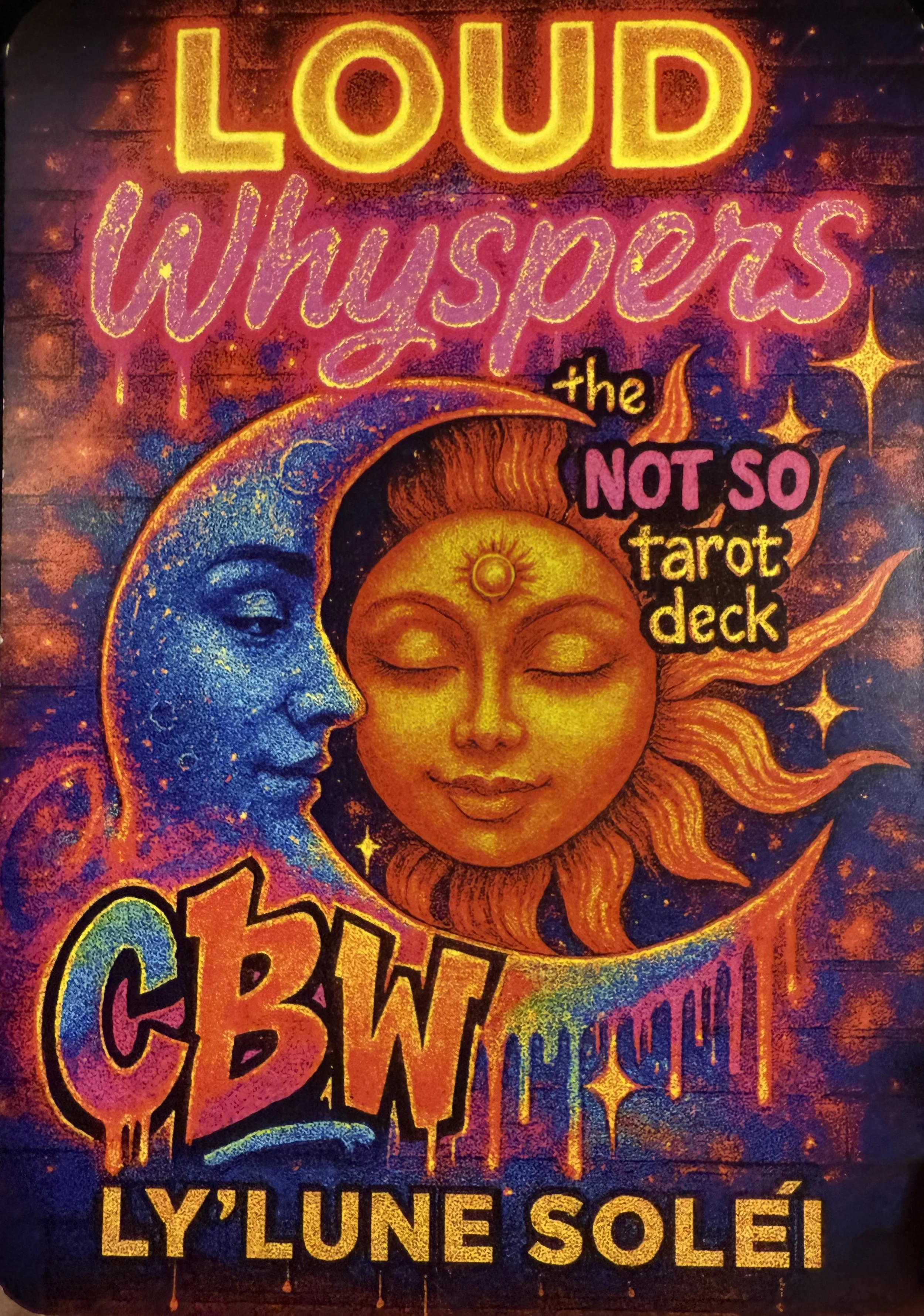 Colorful artistic design featuring the moon and sun with faces, surrounded by stars. Text reads 'Loud Whispers the Not So Tarot Deck' and 'CBW Ly Lune Solé'.
