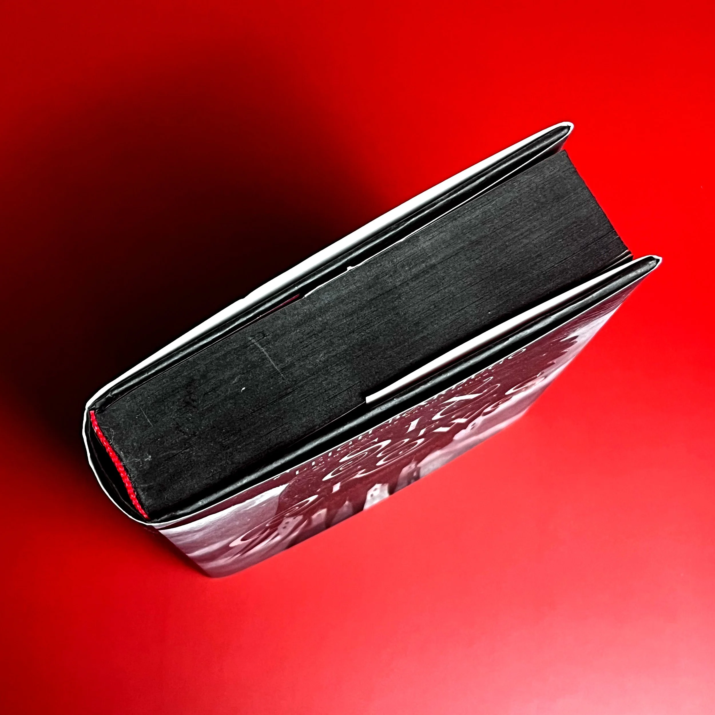 Black sprayed edges on book's pages.