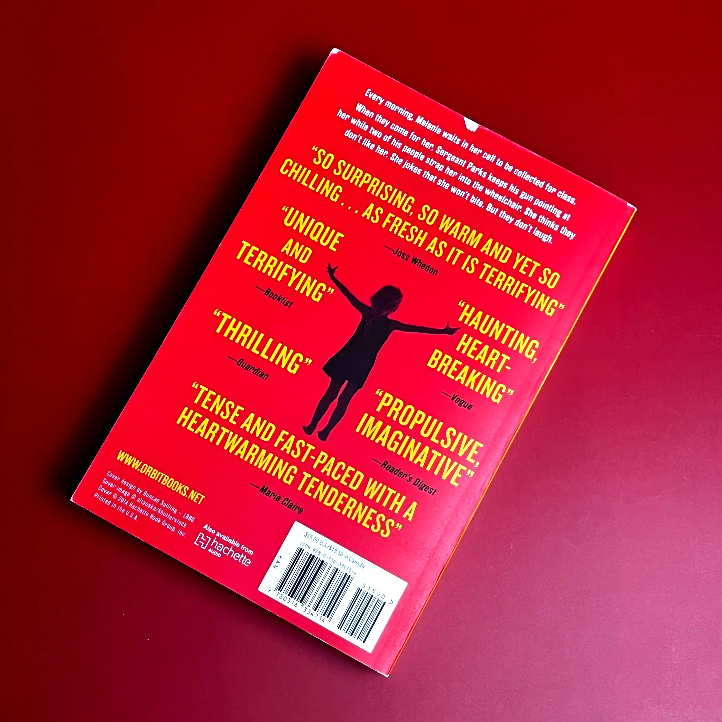 Red back cover with the same silhouette of the girl. Minor tear in cover in the middle of the top of the cover.