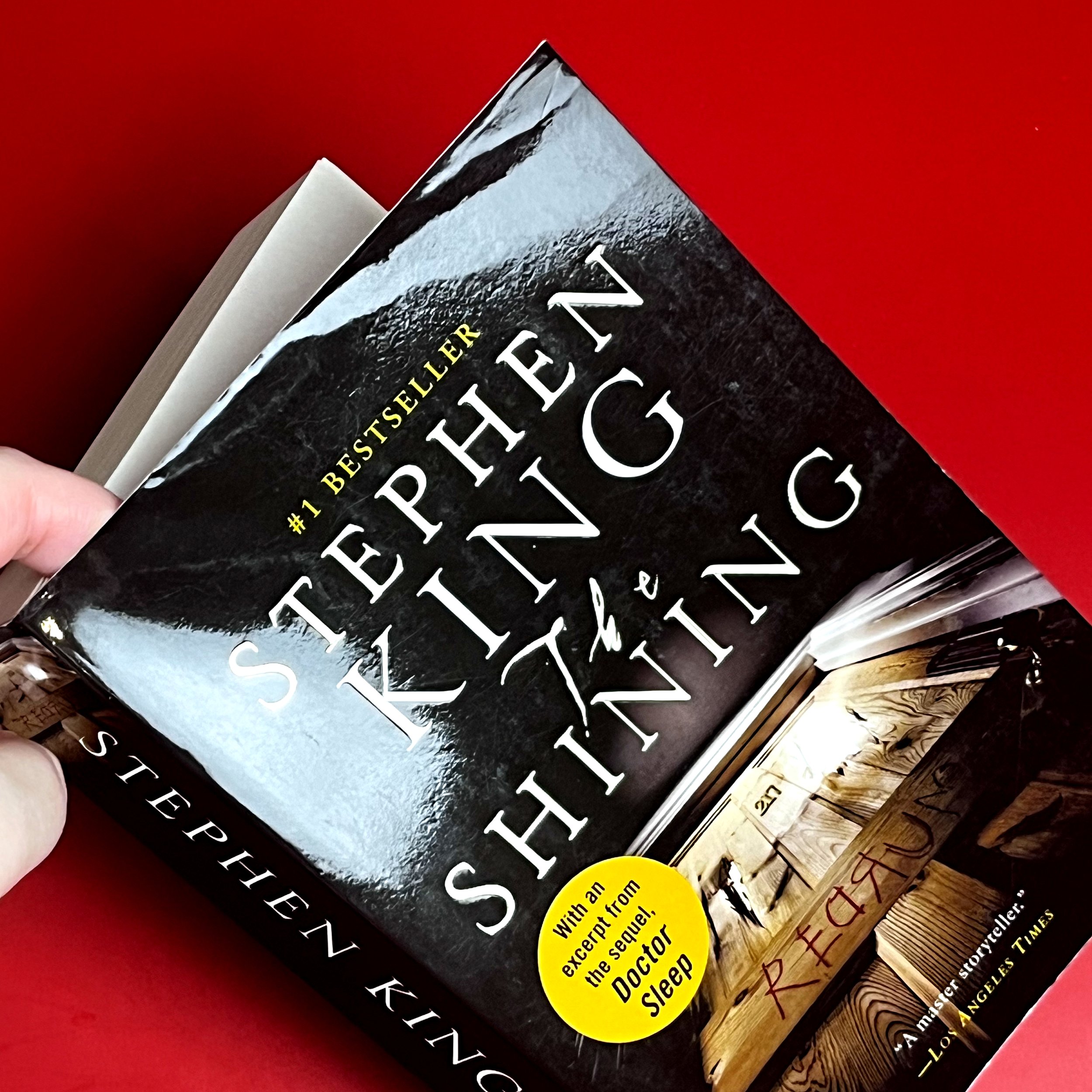 Mild warping to top right corner of front cover that causes a slight crease and bend. Book has shiny cover.