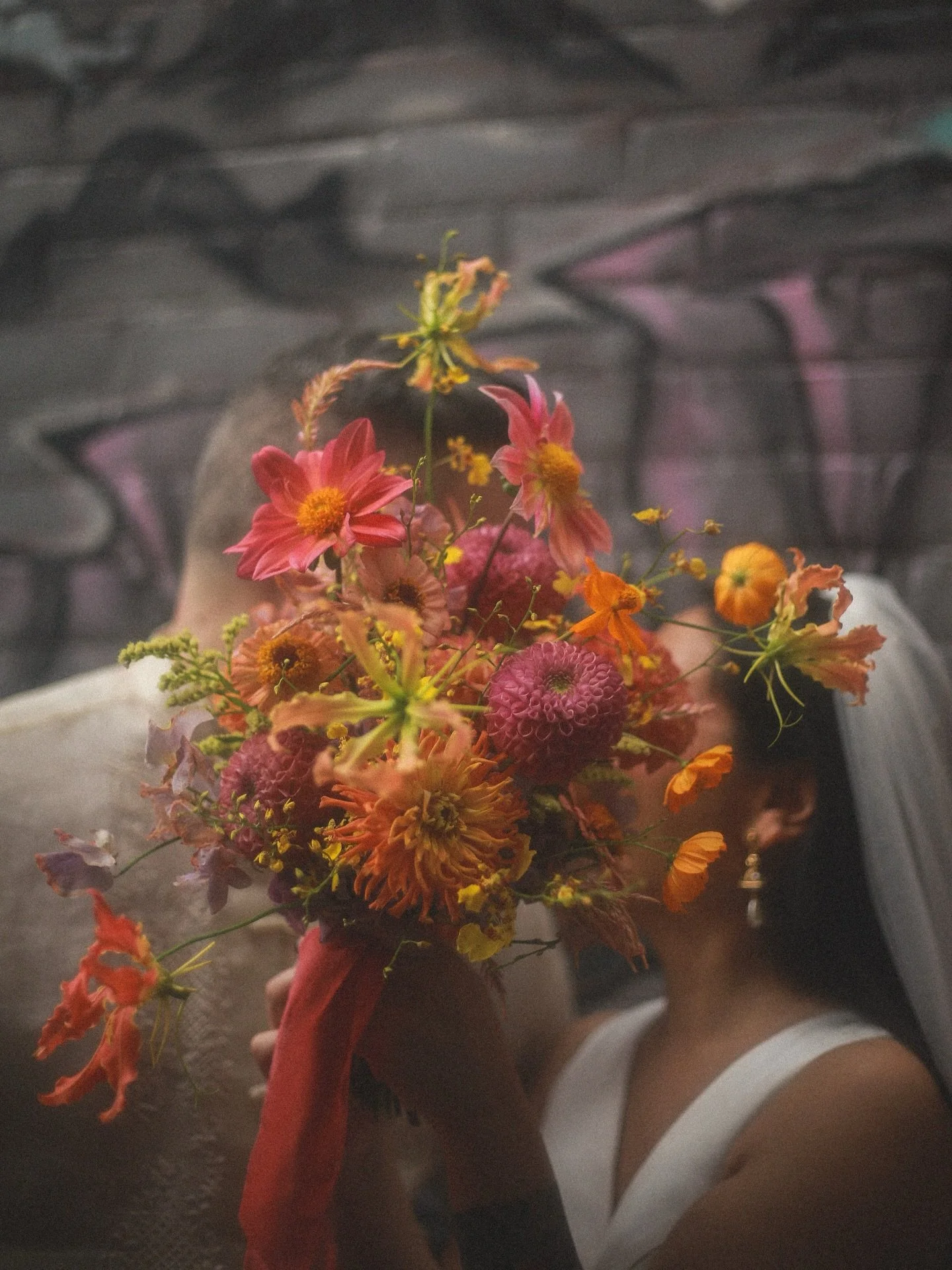 One of my favourite bouquets ❤️&zwj;🔥✨.

She danced playfully down James Street in Abby&rsquo;s hands. Abby and Nick took the leap of faith with @bambinos.hamilton micro wedding and we didn&rsquo;t fail them. This could be you this very August, reac