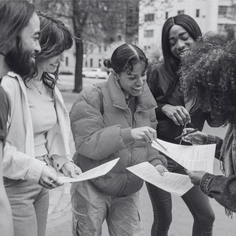 Two hands holding a heart with rays emanating from it, symbolizing love and care.