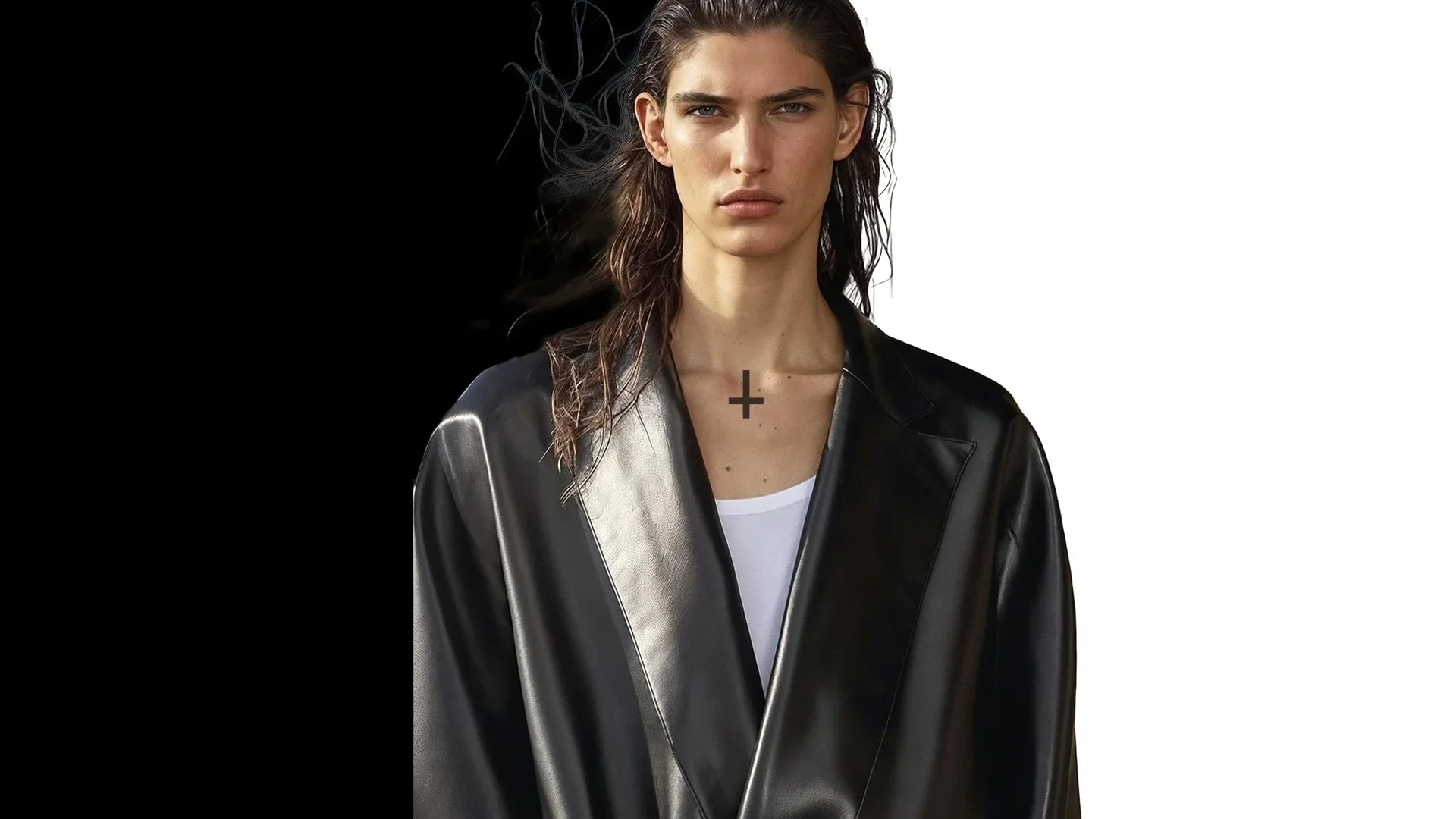A woman with wet brown hair, wearing a black leather jacket over a white top, standing against a background split into black and white halves.