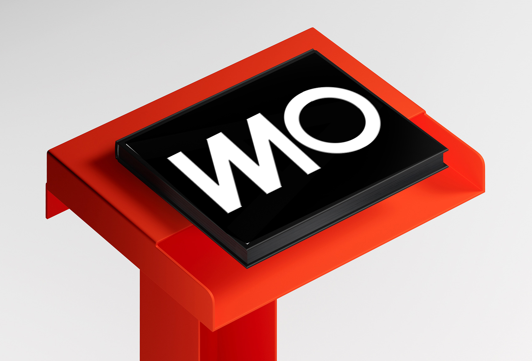 Close-up of a sign displaying the letters 'O' and 'W' on a black background, mounted on a red stand.