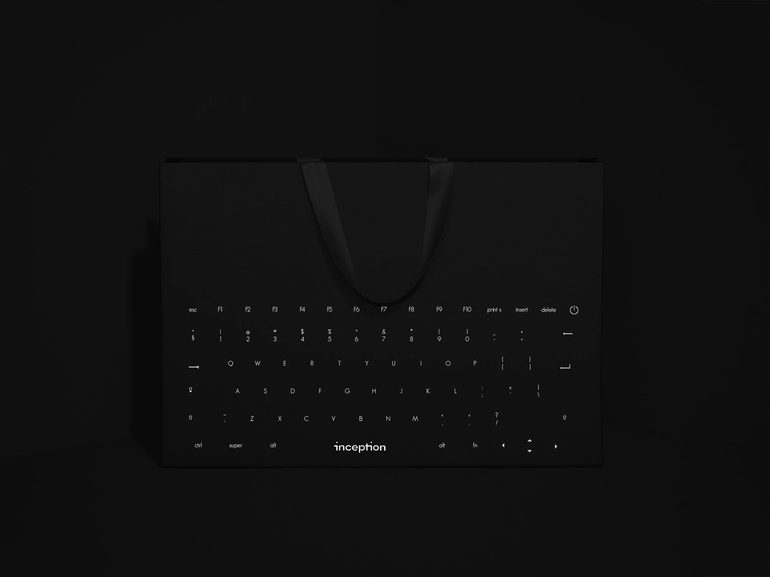 A sleek black keyboard with backlit keys, displaying the word 'inception' on a dark background.