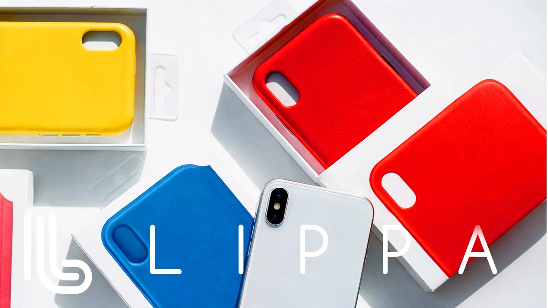 Multiple colorful phone cases in yellow, red, blue, and white, with a smartphone in a white case, arranged on a white background.