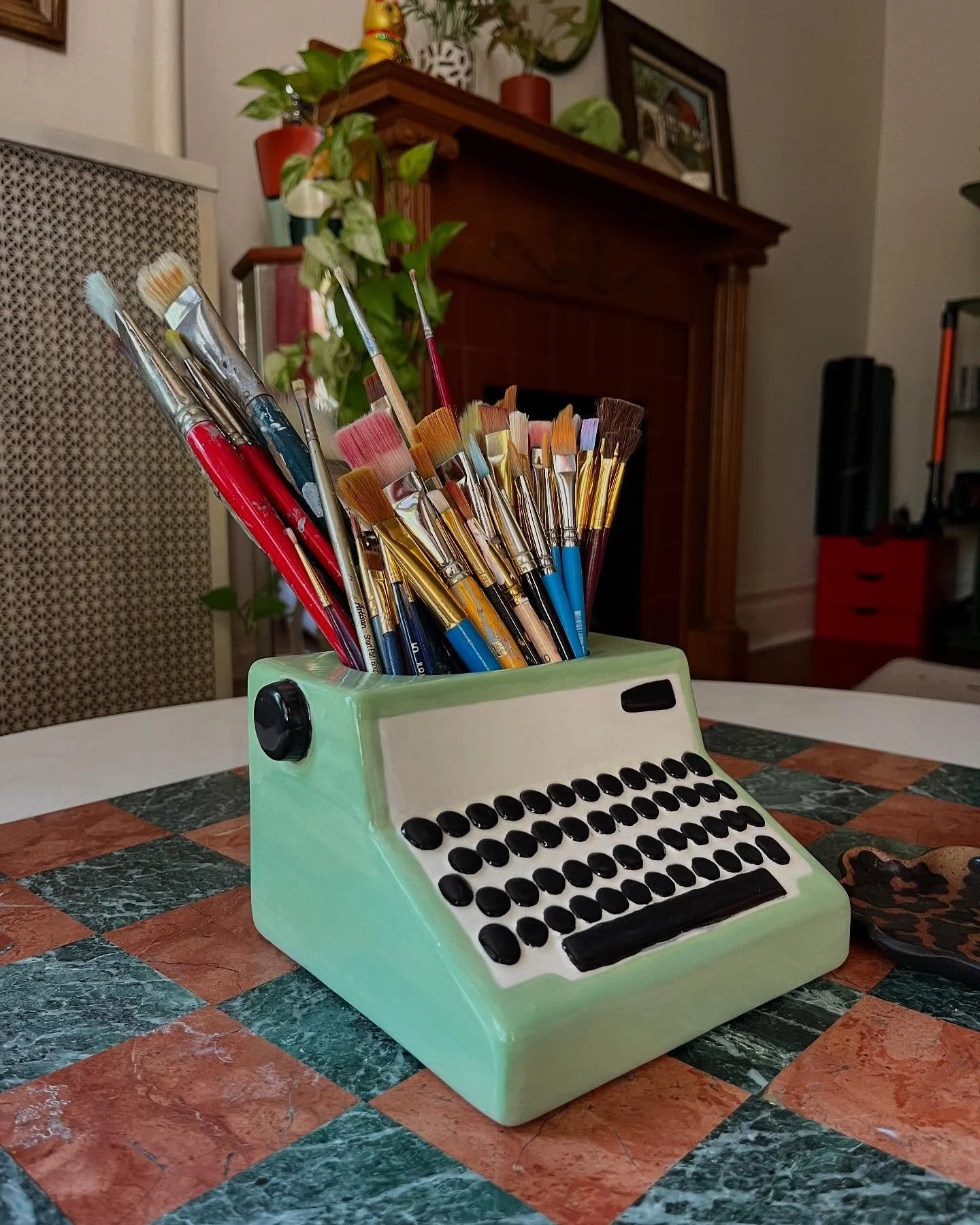 painted this big ole ceramic typewriter planter to store all my brushes!! 🌱🪸💕🐛🎨🪺