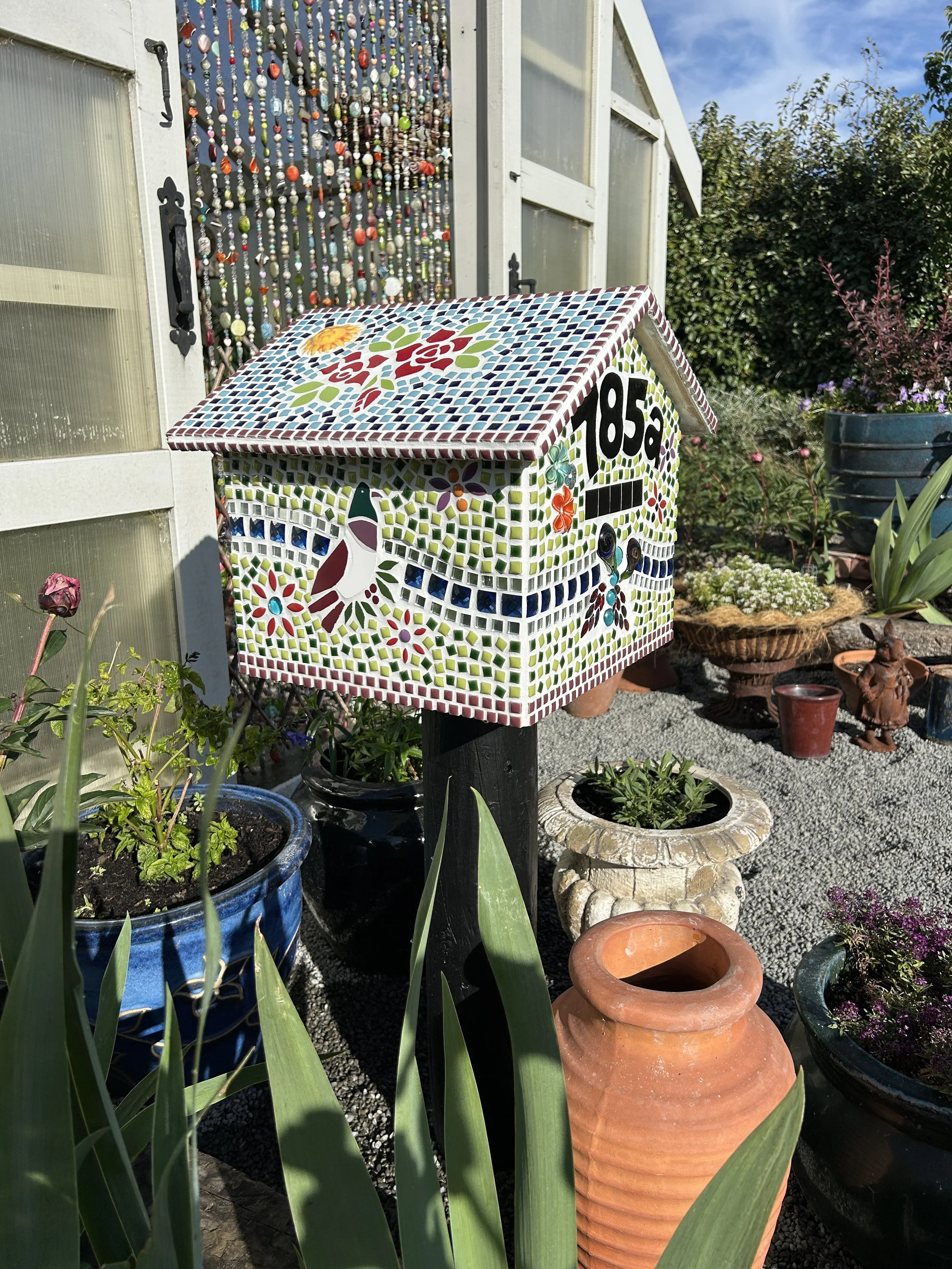 What?! Your greenhouse doesn’t have a letterbox?