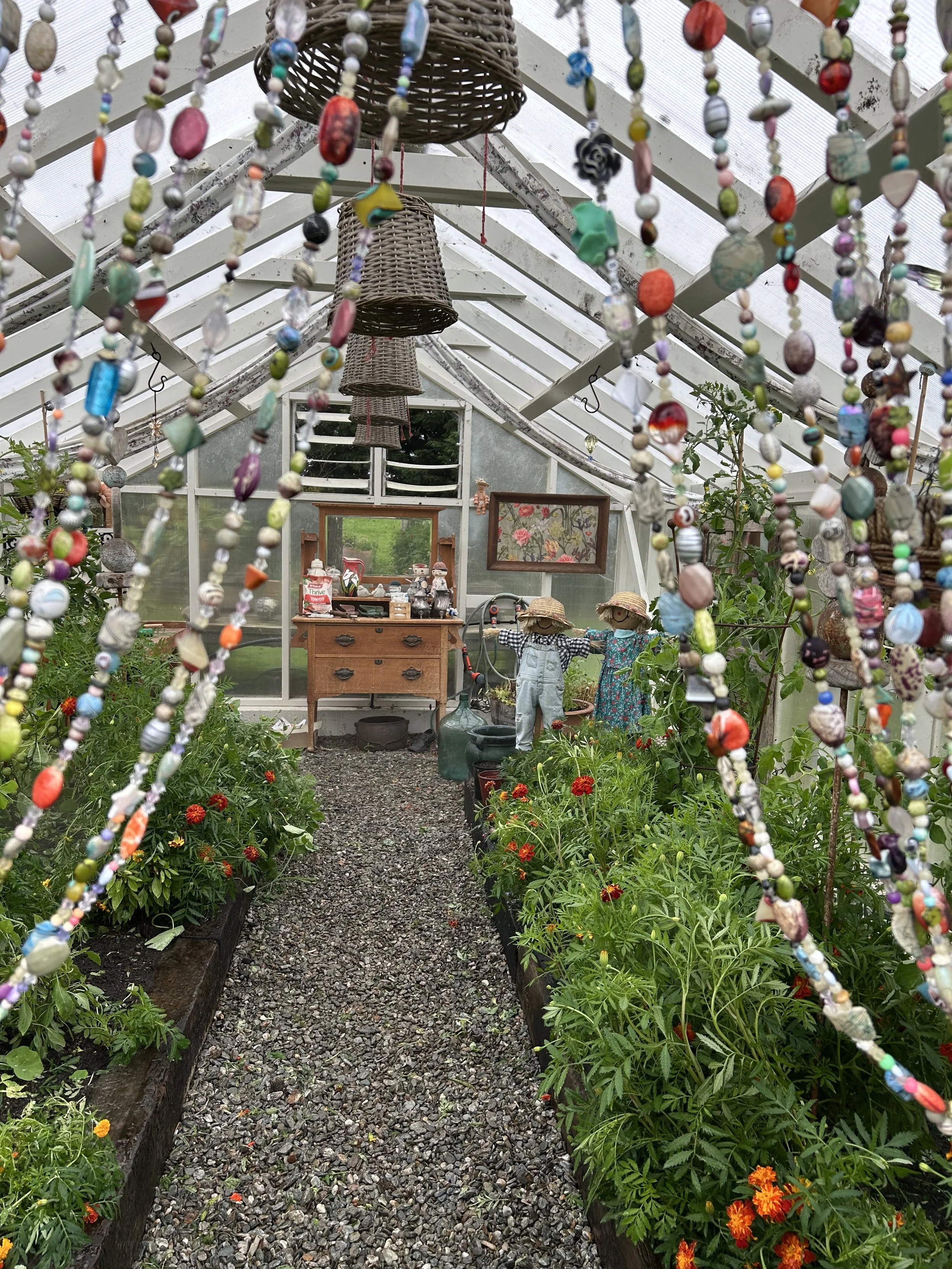The Whitehouse - my greenhouse.  A bead curtain stops birds getting in and the vintage styling means this is my happy place any time of the year.  I use companion planting to keep my veges pest-free without using chemicals.  